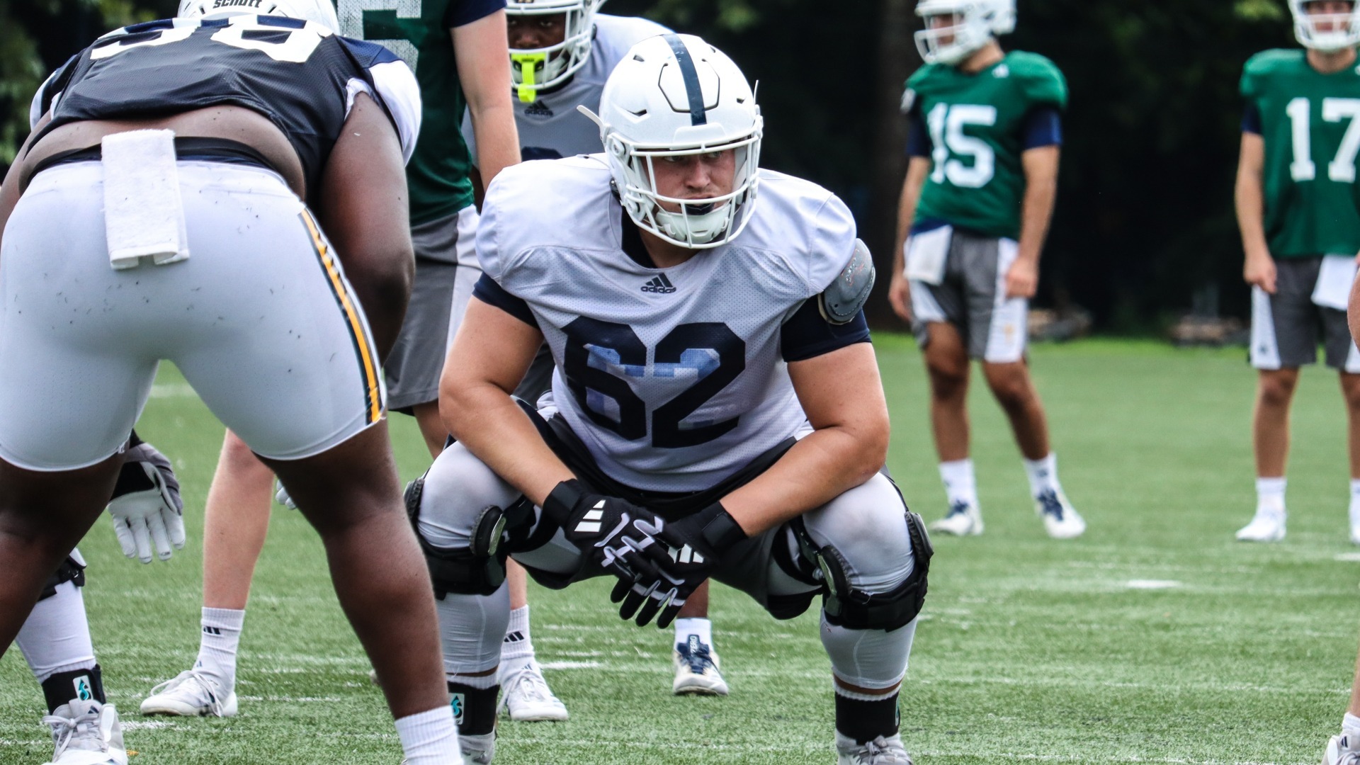 Offensive guard Jacob Ziegler sits in a deep crouch surveying the defense pre-snap during the Mocs fall camp