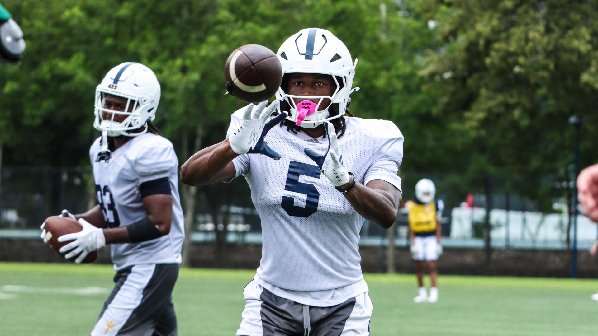 Josh Williams prepares to catch an approaching pass during fall preseason camp
