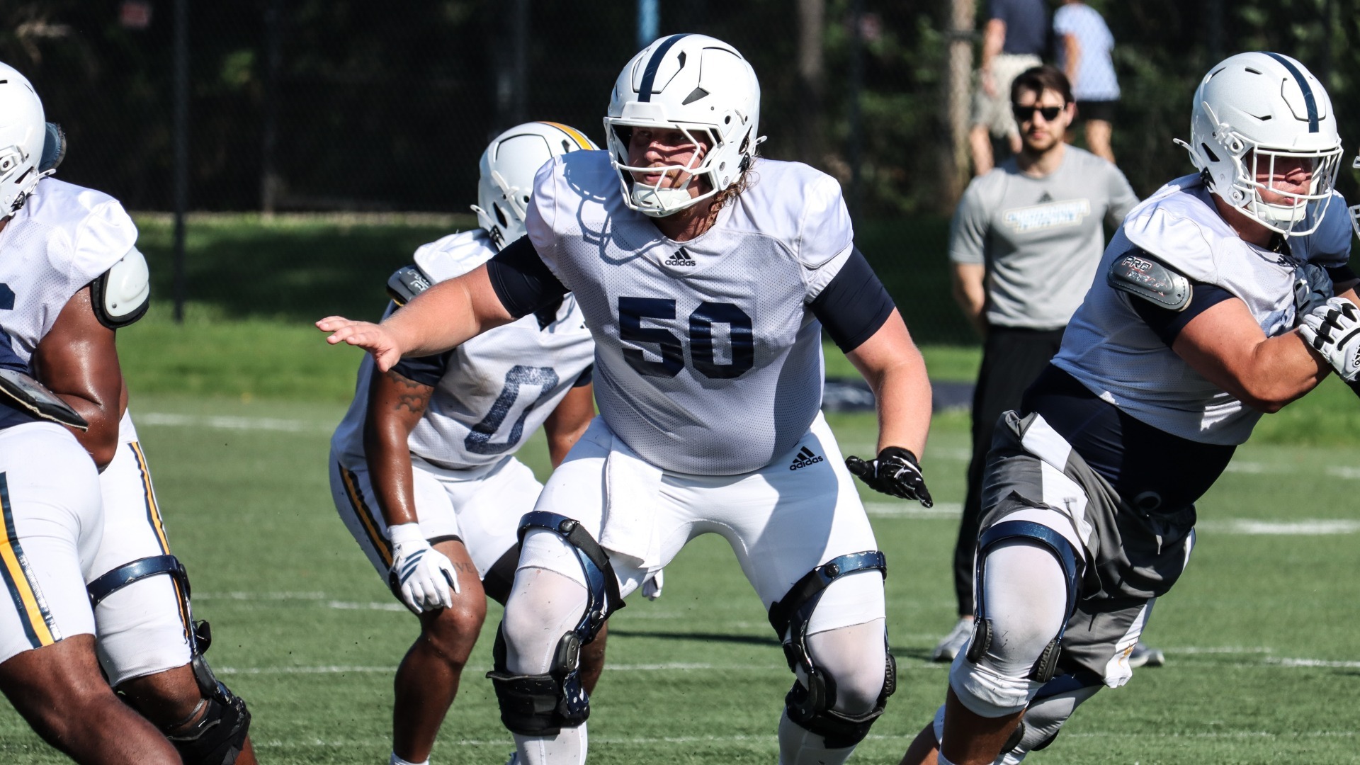 Devin Lively sits back in his pass blocking zone during fall camp.