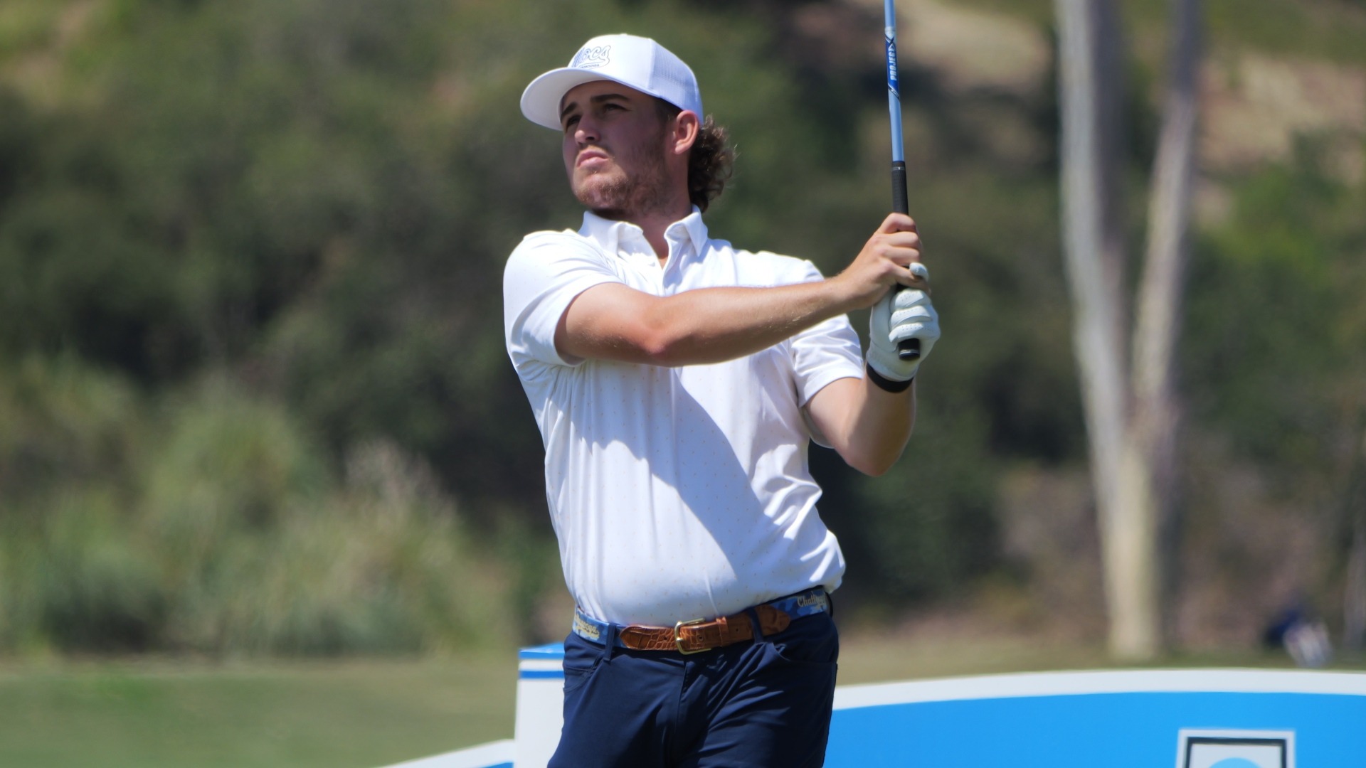 Ethan Whitaker holds his pose with an iron off the tee staring down his ball at the NCAA Finals.