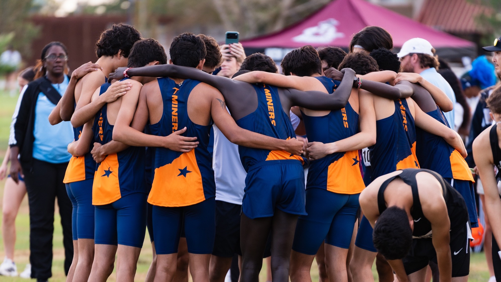 Men's XC Team huddle