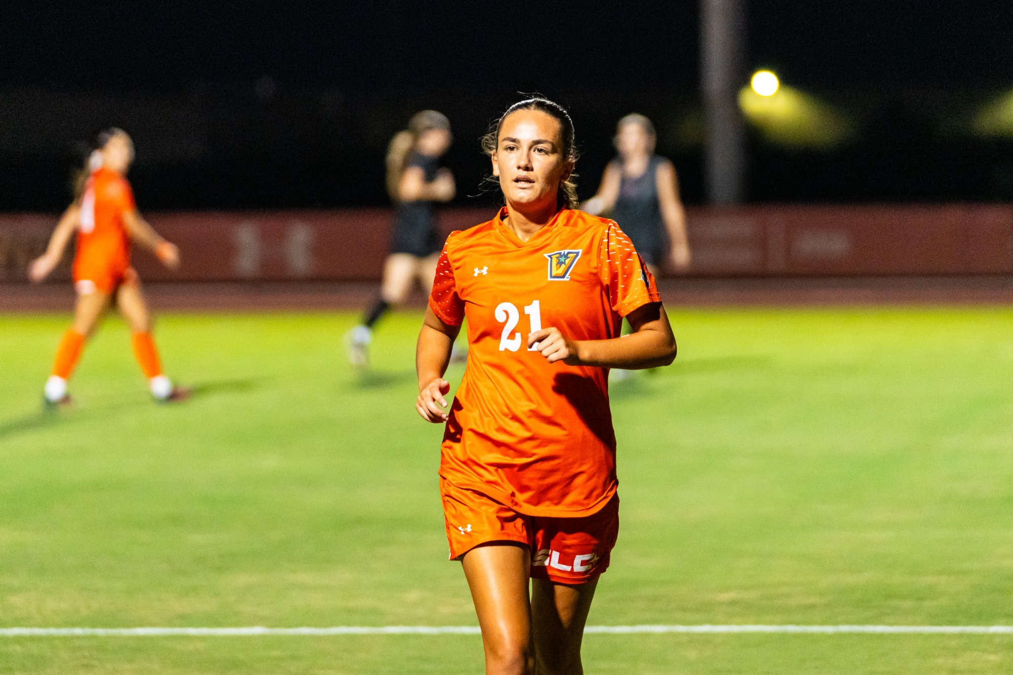 Action shot of senior Libby Pole for WSoc UP NEXT