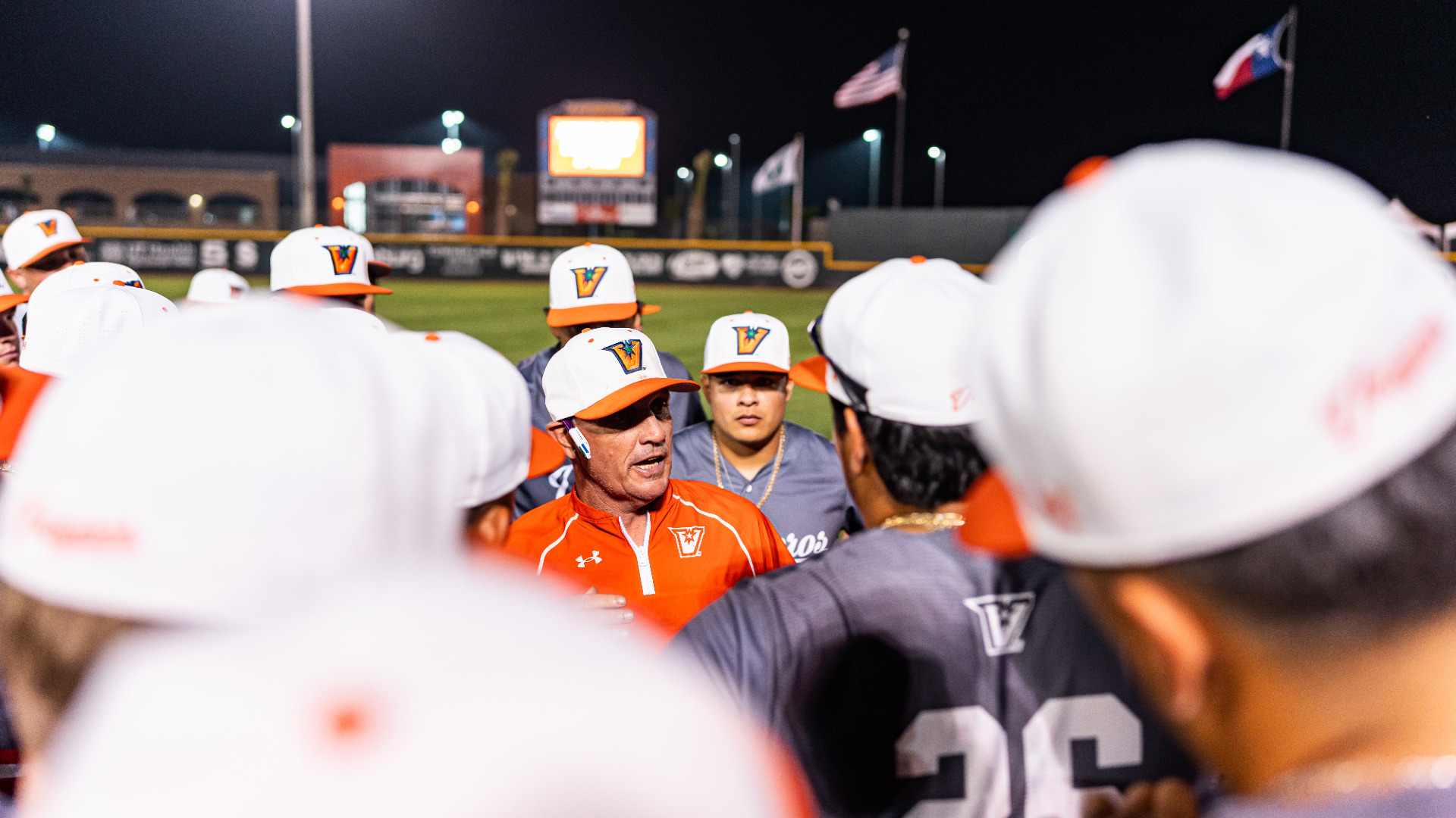 Coach Matlock addressing his team in a huddle 3-7-26
