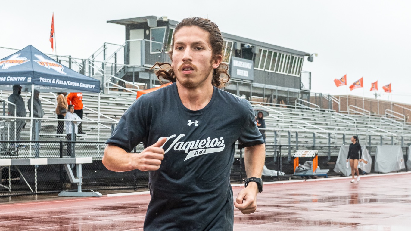 Image is of UTRGV track & field junior Kevin Cardenas running on the track at UTRGV Soccer and Track & Field Complex.