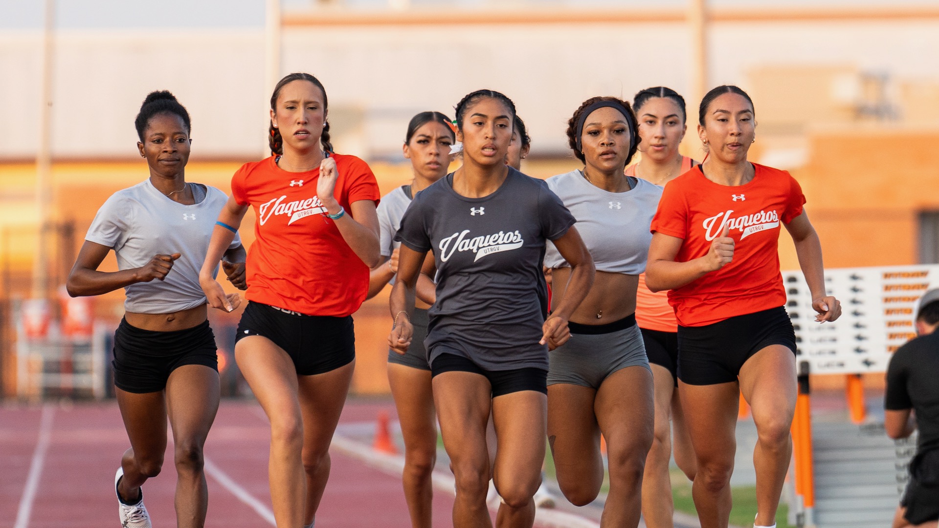 Photo of a group of UTRGV women's distance runners during the Orange and Gray meet at UTRGV Soccer and Track & Field Complex