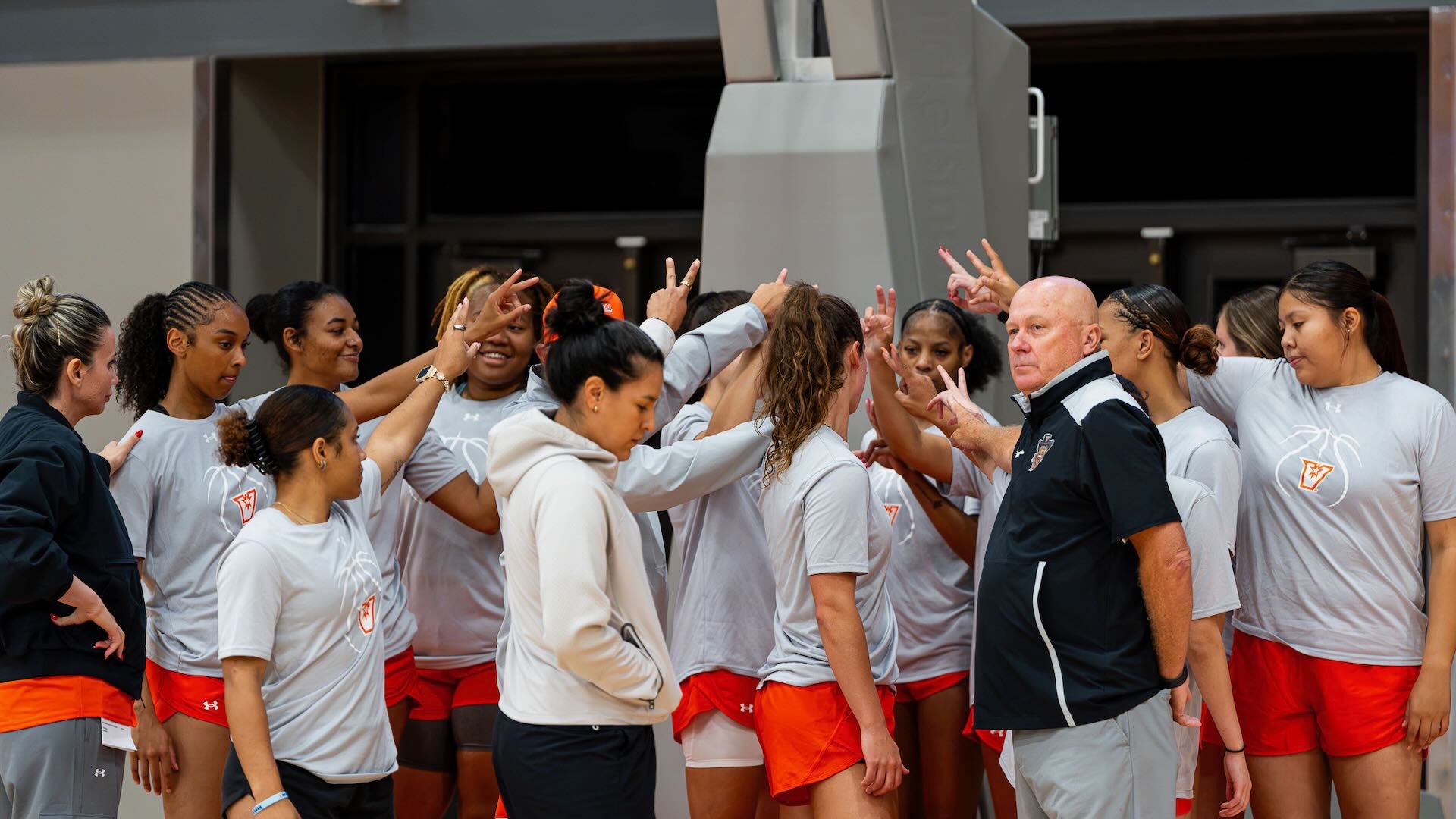 Photo shows the UTRGV women's basketball team huddling after practice.