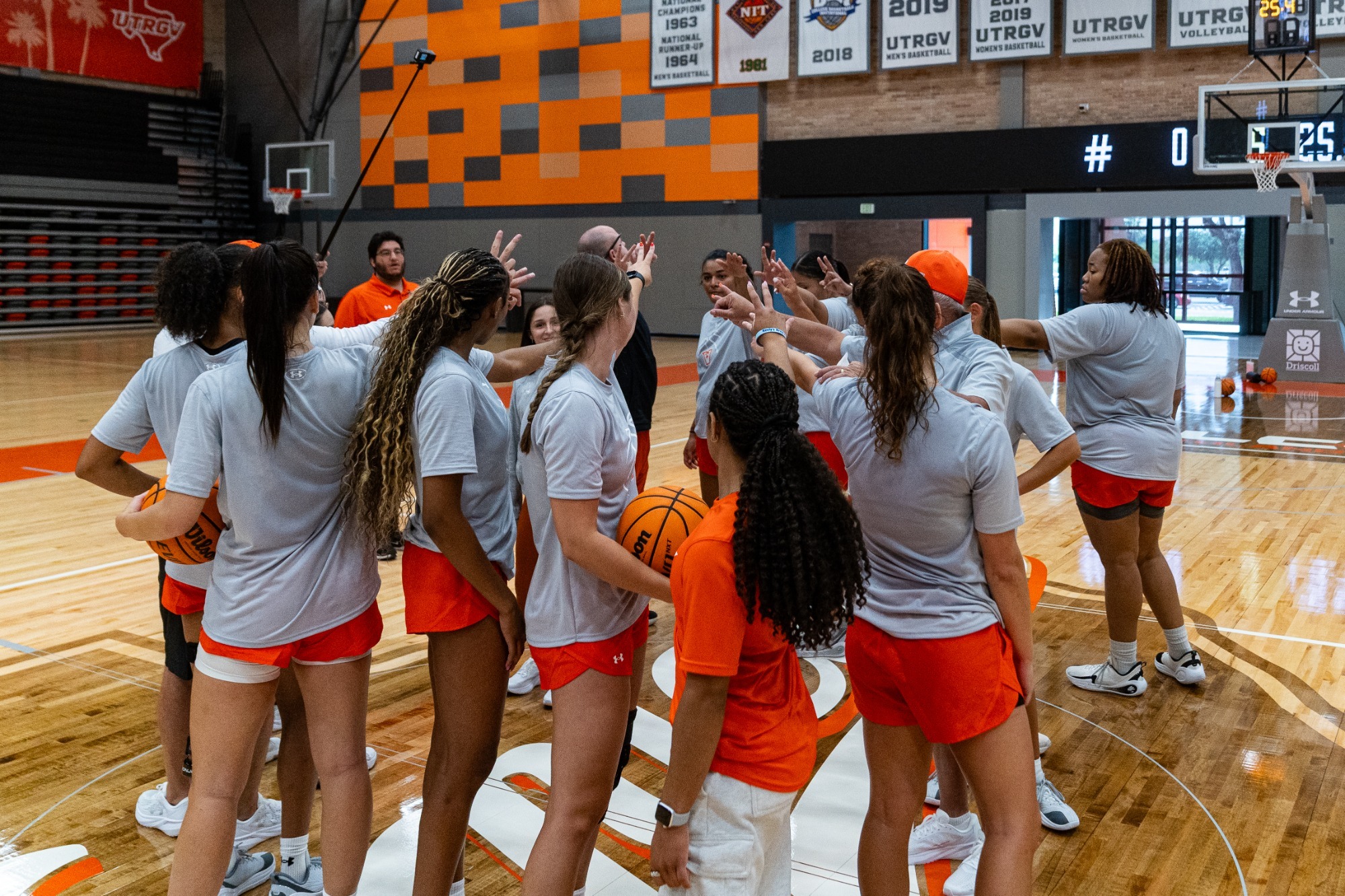 Women's Basketball Huddles after First Practice