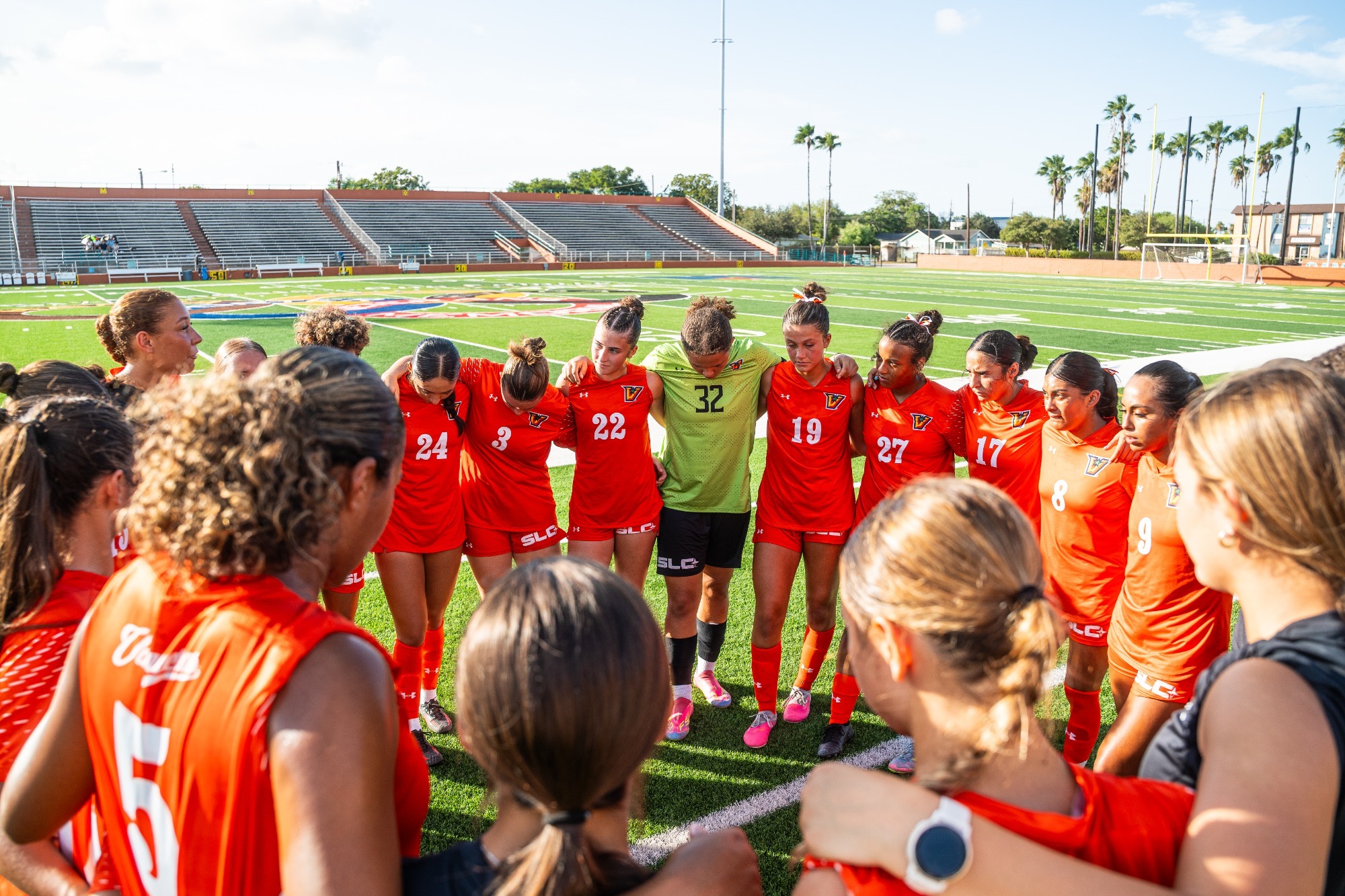 Women's soccer team huddle 