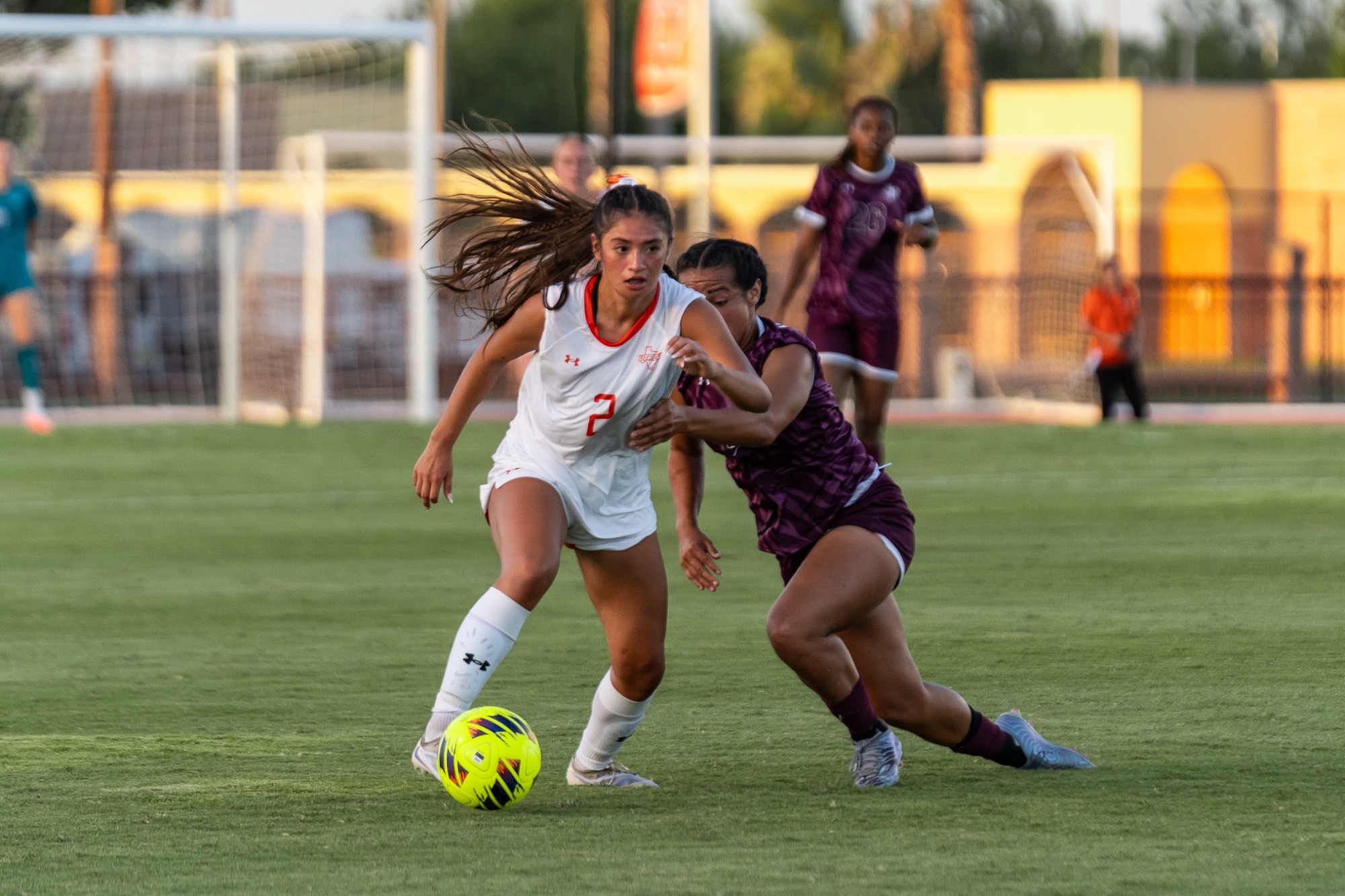 Anuhea Aalona dribbing the soccer ball past an opponent versus Texas Southern
