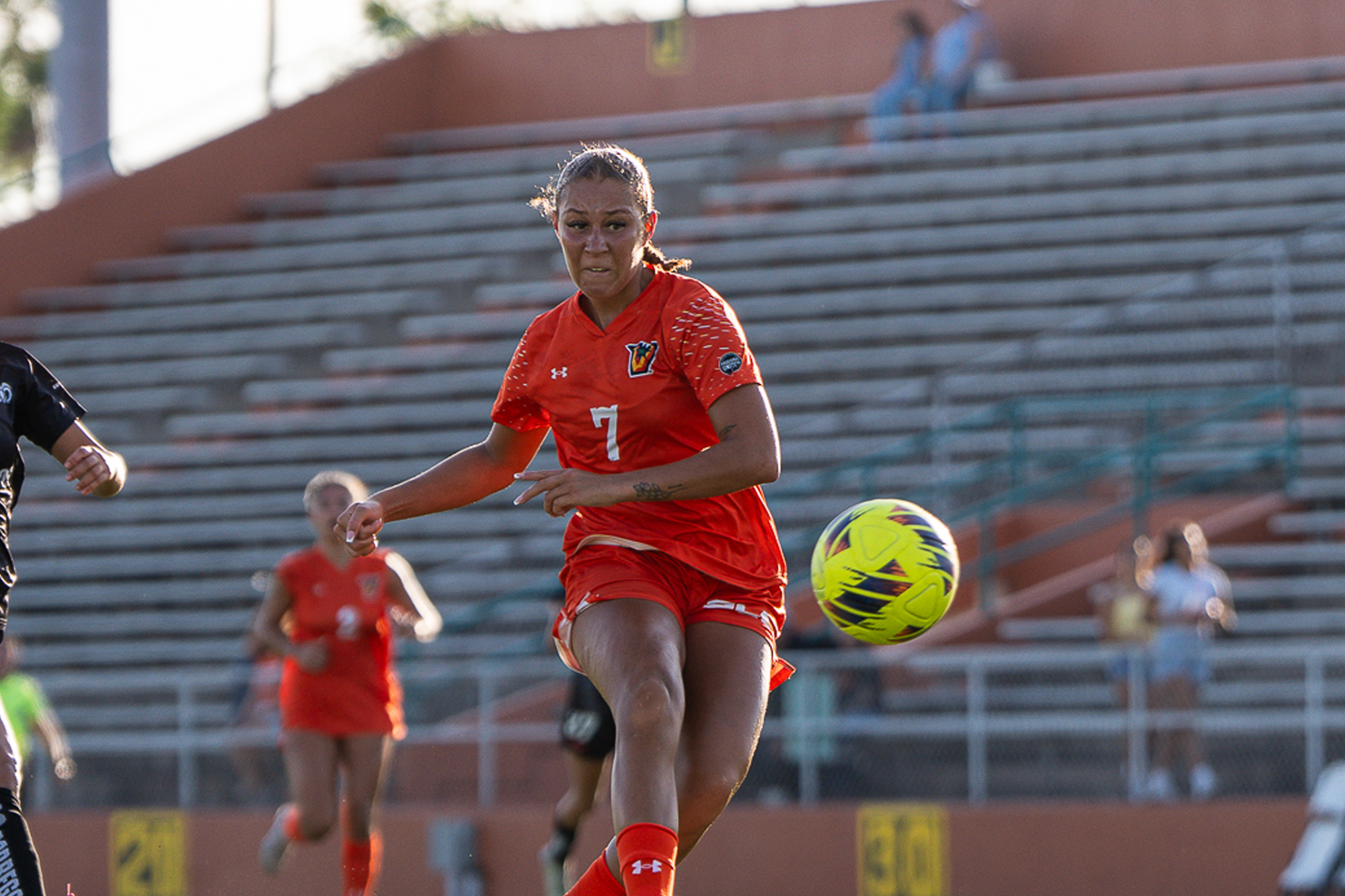 Isabella Burtini SLC Offensive player of the week photo against Tec de Monterrey with yellow soccer ball