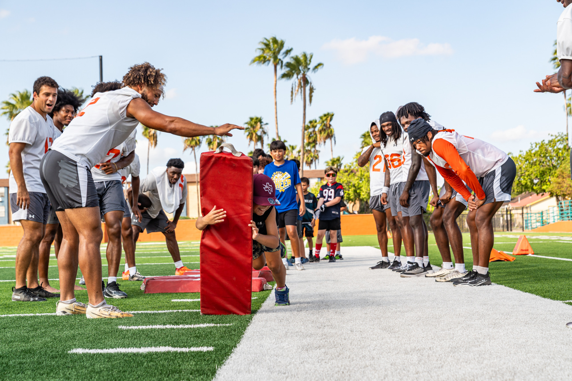 Kids practice tackling during a youth football clinic in Brownsville's Sams Stadium on 8/6/26