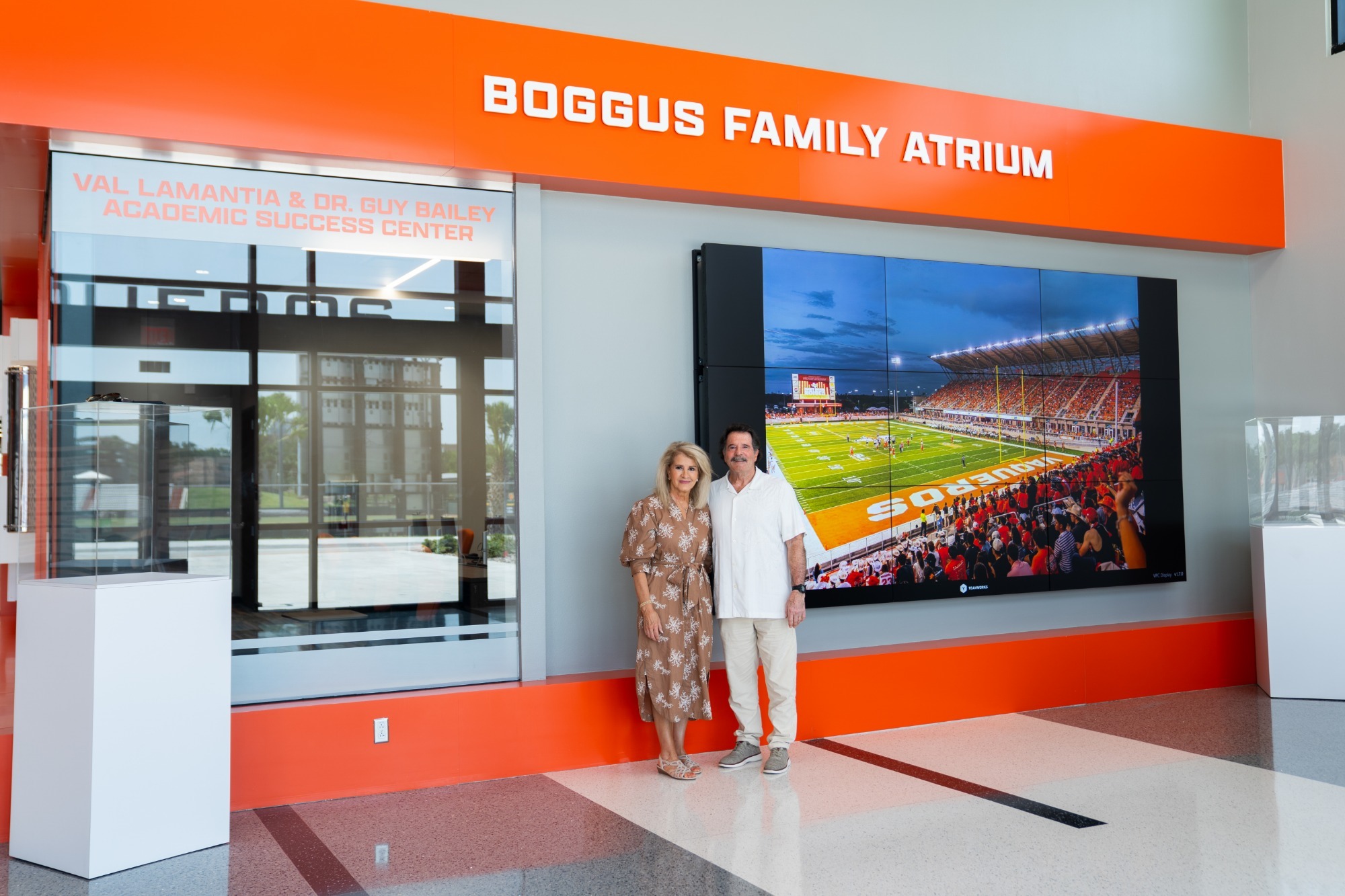 Photo of Bob and Karen Boggus at the Boggus Family Atrium in the Vaqueros Performance Center