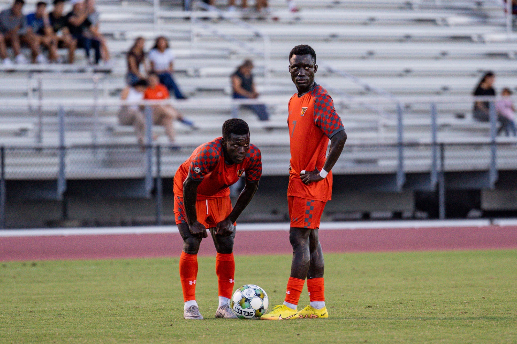 #11 Malang Mandiang and #7 Mouhamed Pouye Standing Side-by-Side on the pitch