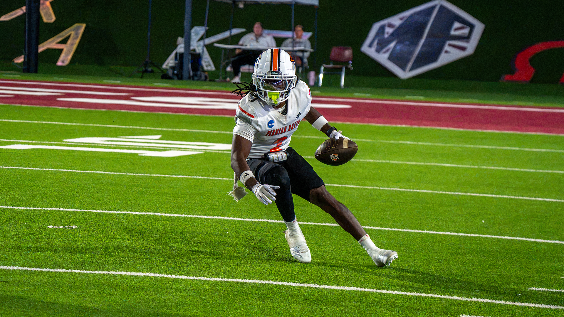 Traylen Suel running with football
