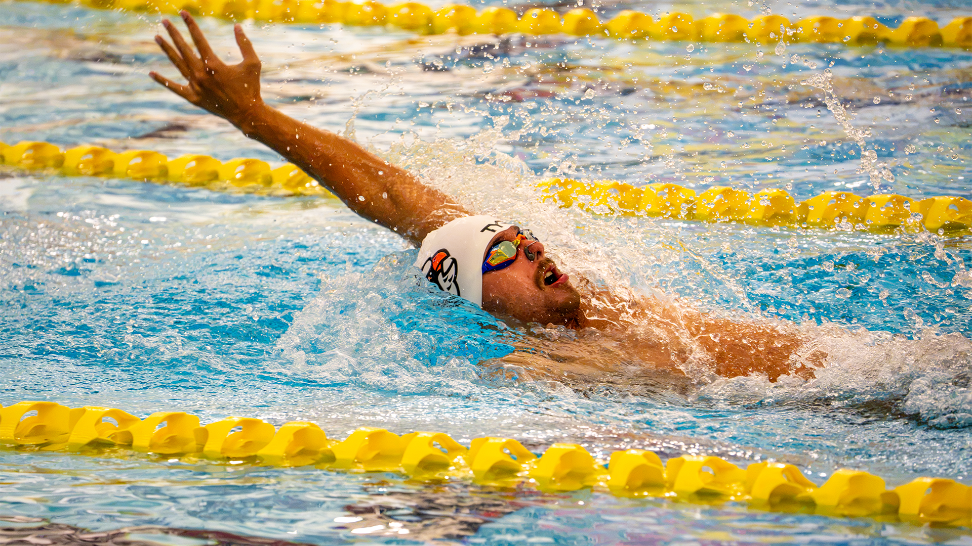 UTPB swimmer performing the backstroke