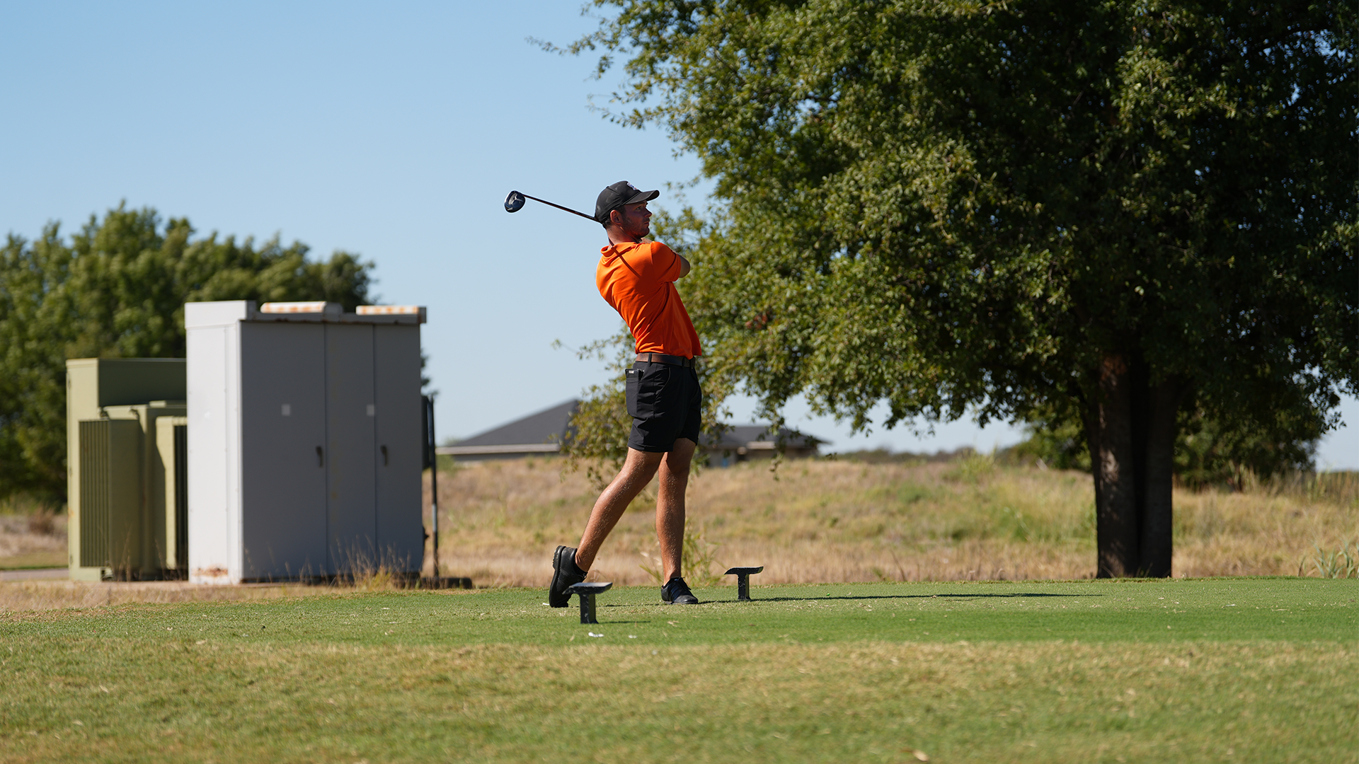 Ioan Rowe swinging golf club