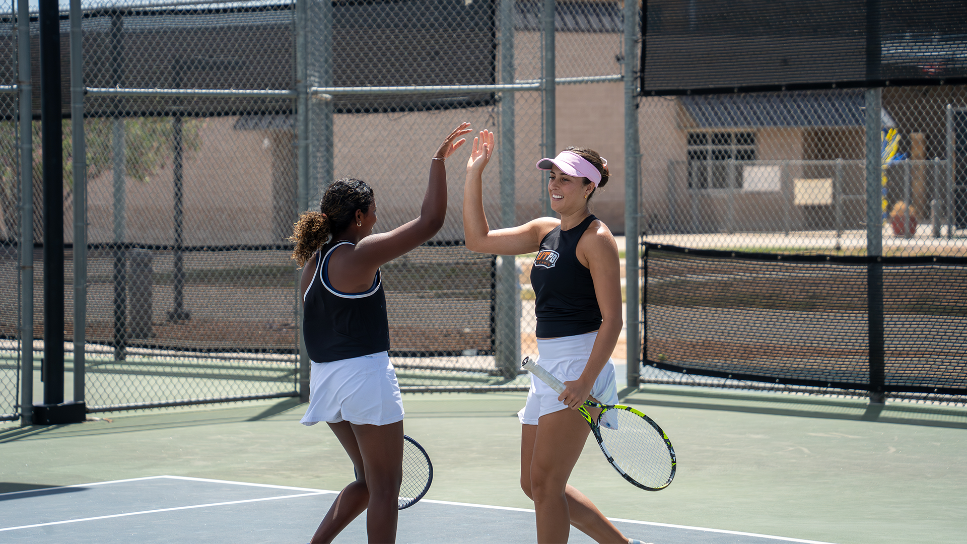  Dinethya Dharmaratne and Sophia Rashid high five