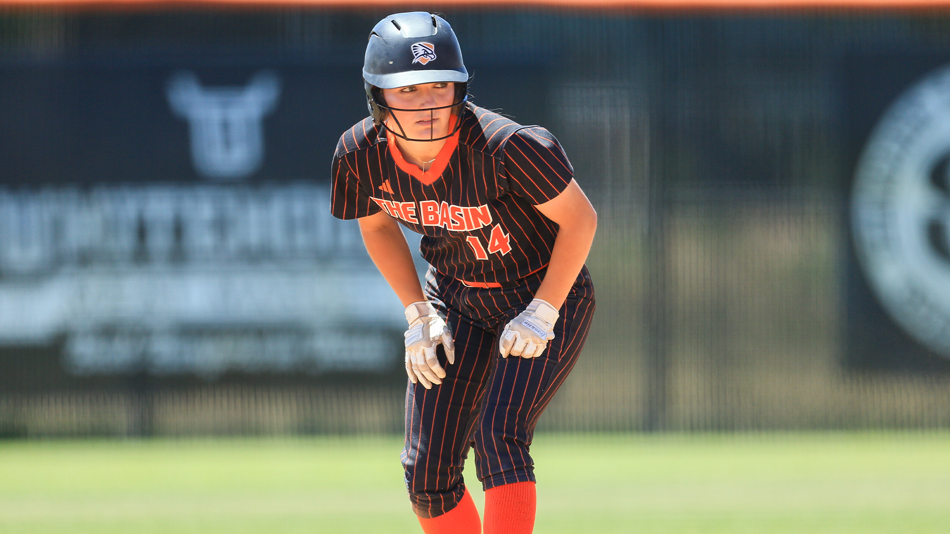 Carlee Quintero on base waiting for ball to be pitched
