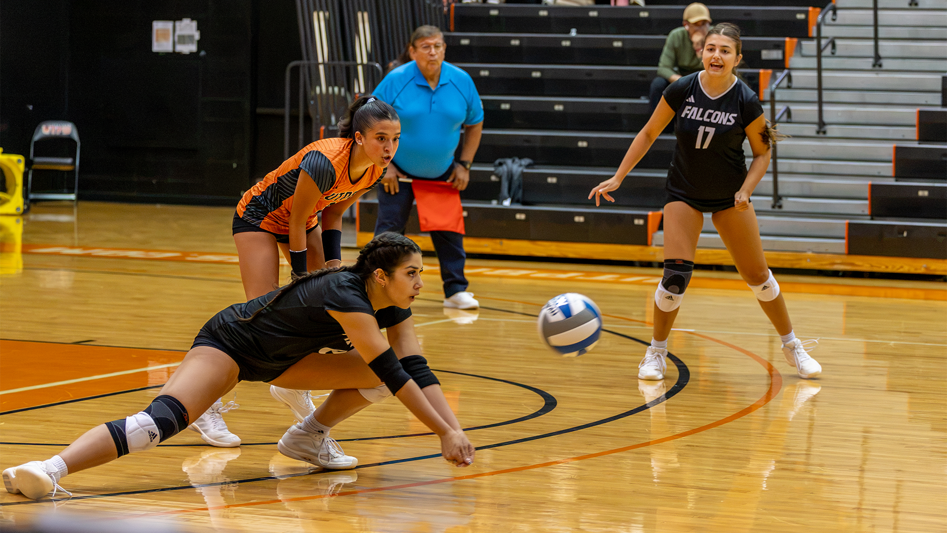 Giselle Orellana digs the ball