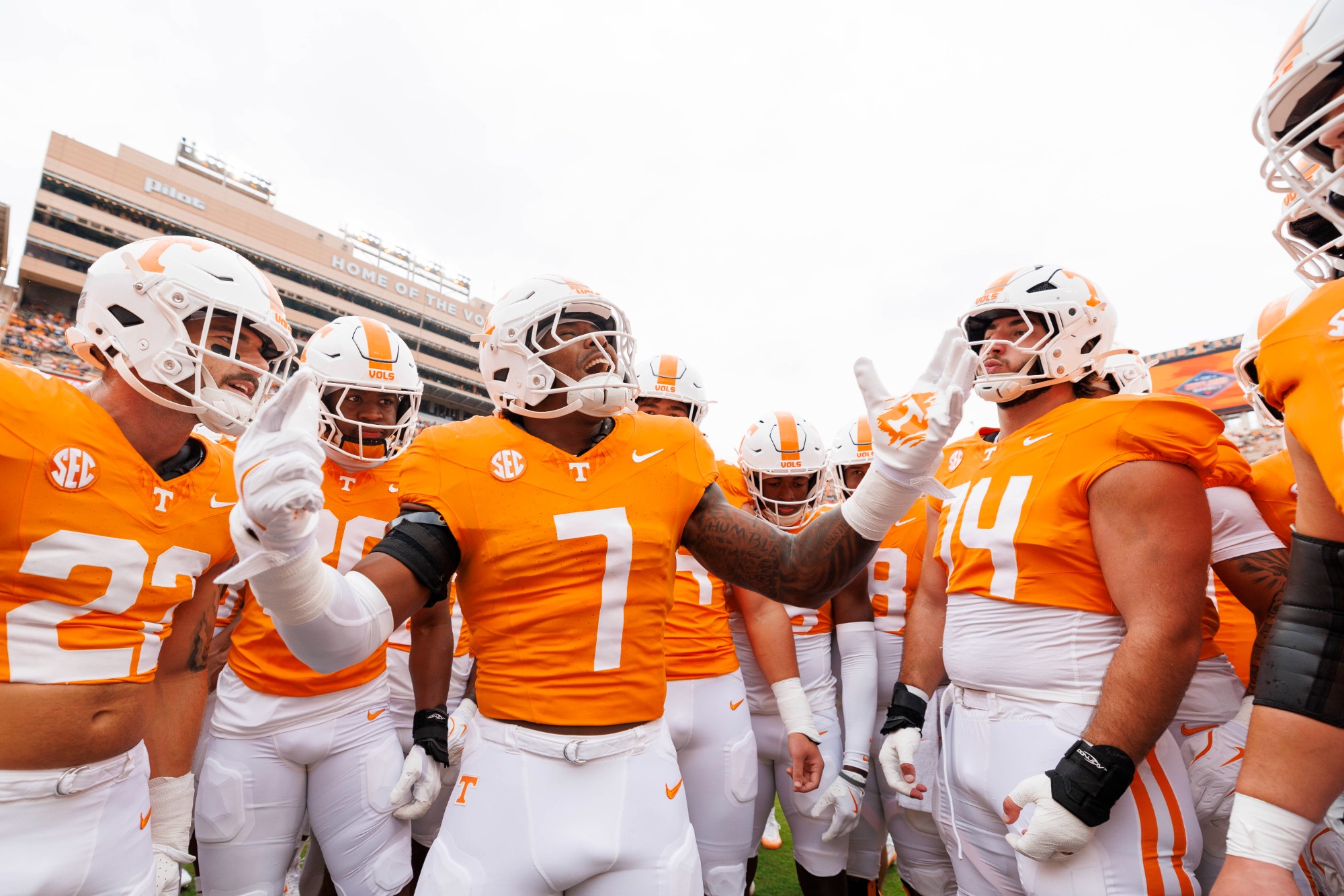 Tennessee linebacker Arion Carter number 7 surrounded by Volunteers teammates at Neyland Stadium