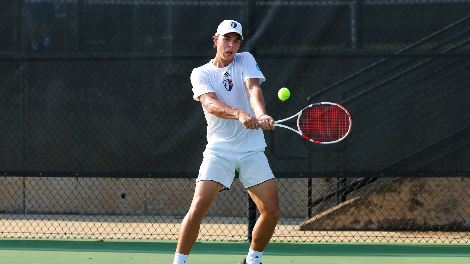 Daniil Felker goes for a backhand return during the Tyler Invite.