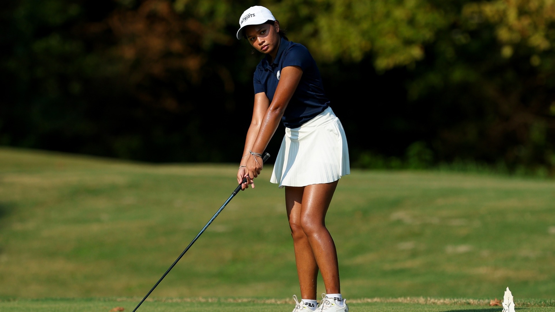 Arnie Taguines prepares to hit a tee shot at Hollytree Country Club.