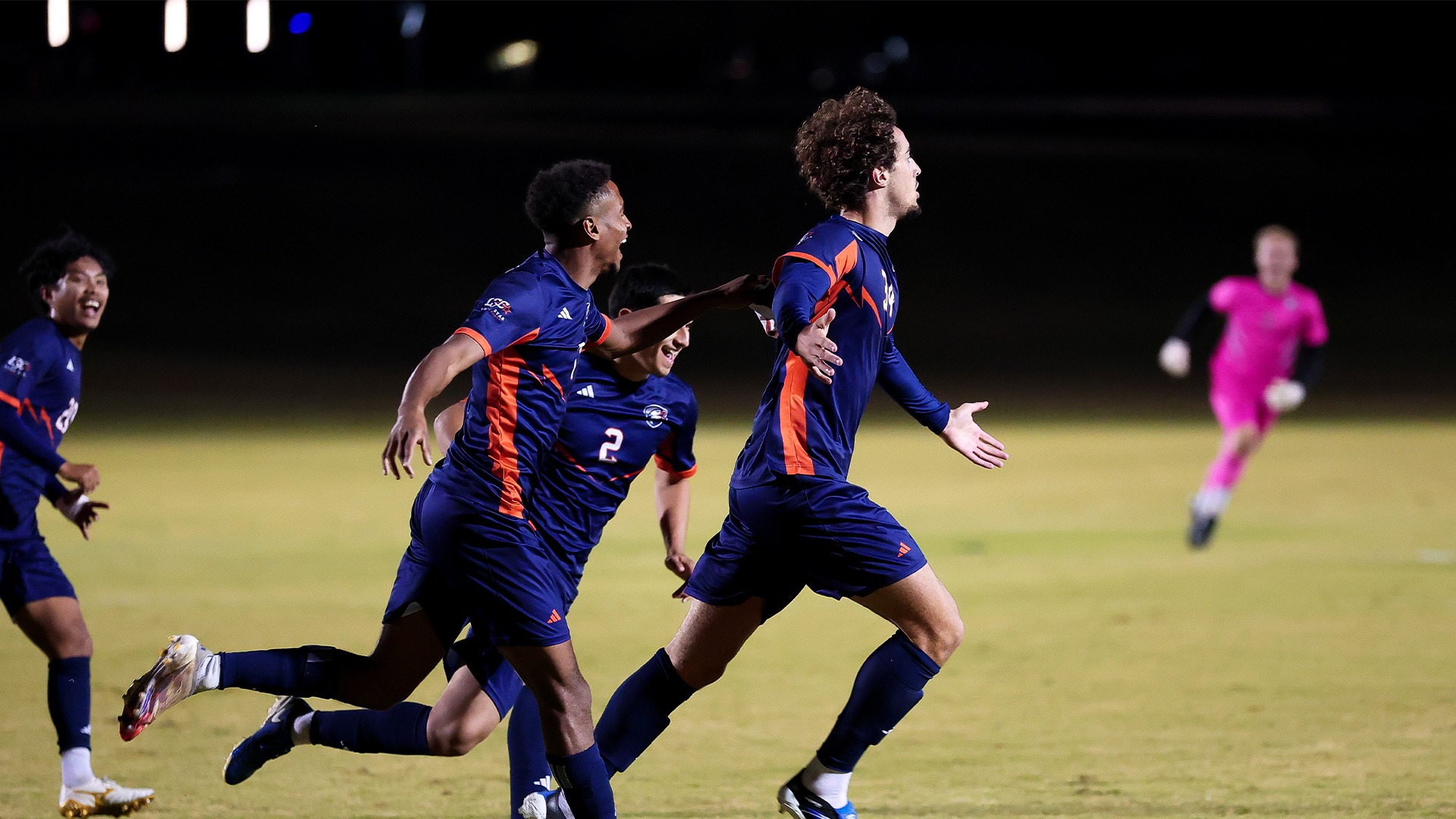 Jason Verhoogen and his teammates celebrate after an opening goal against UT Dallas.