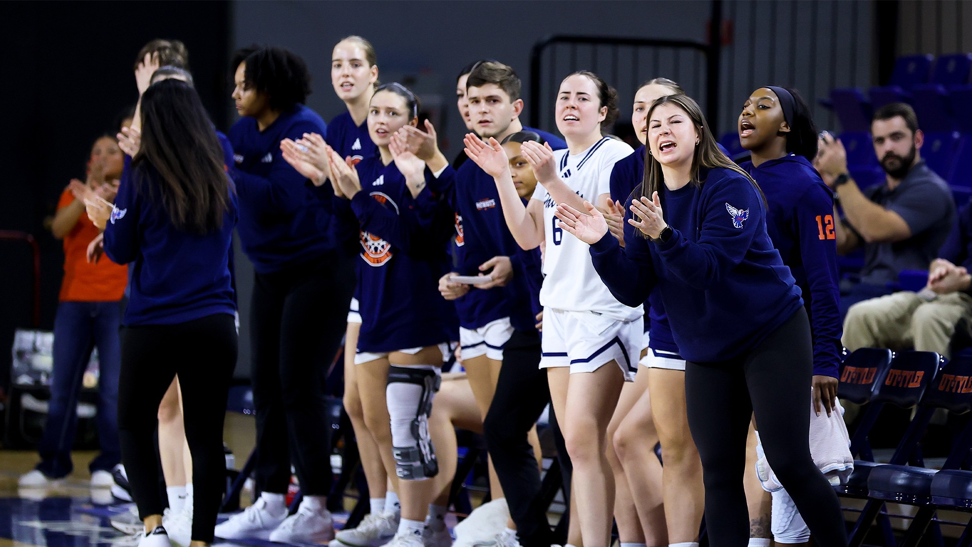 The UT Tyler Women's Basketball bench celebrates a point against St. Edward's.