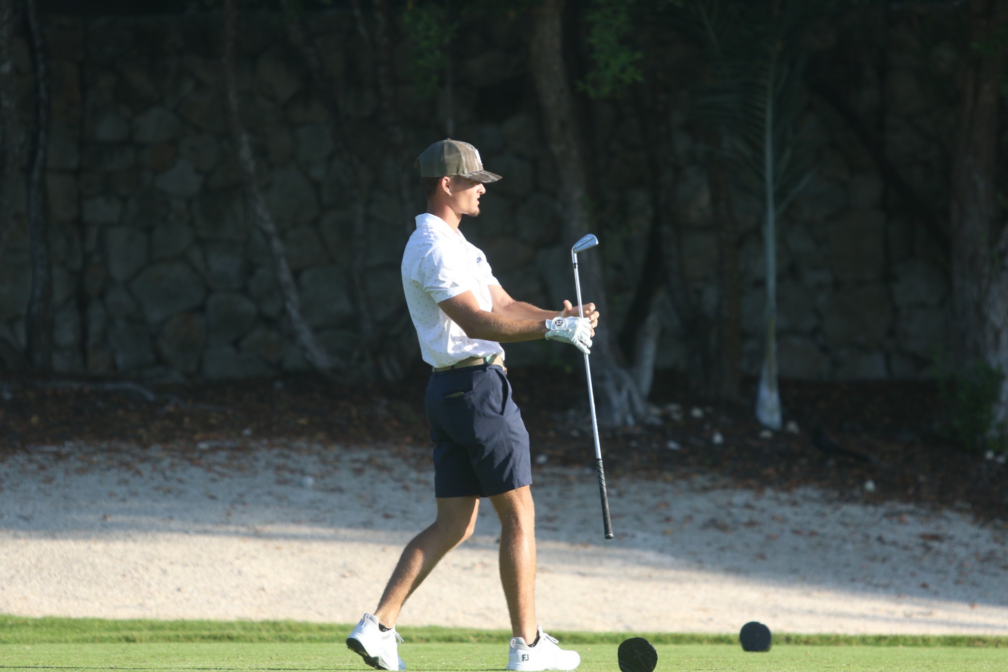 Preston DeSerrano hits an iron at the DII Shootout at PGA Riviera Maya