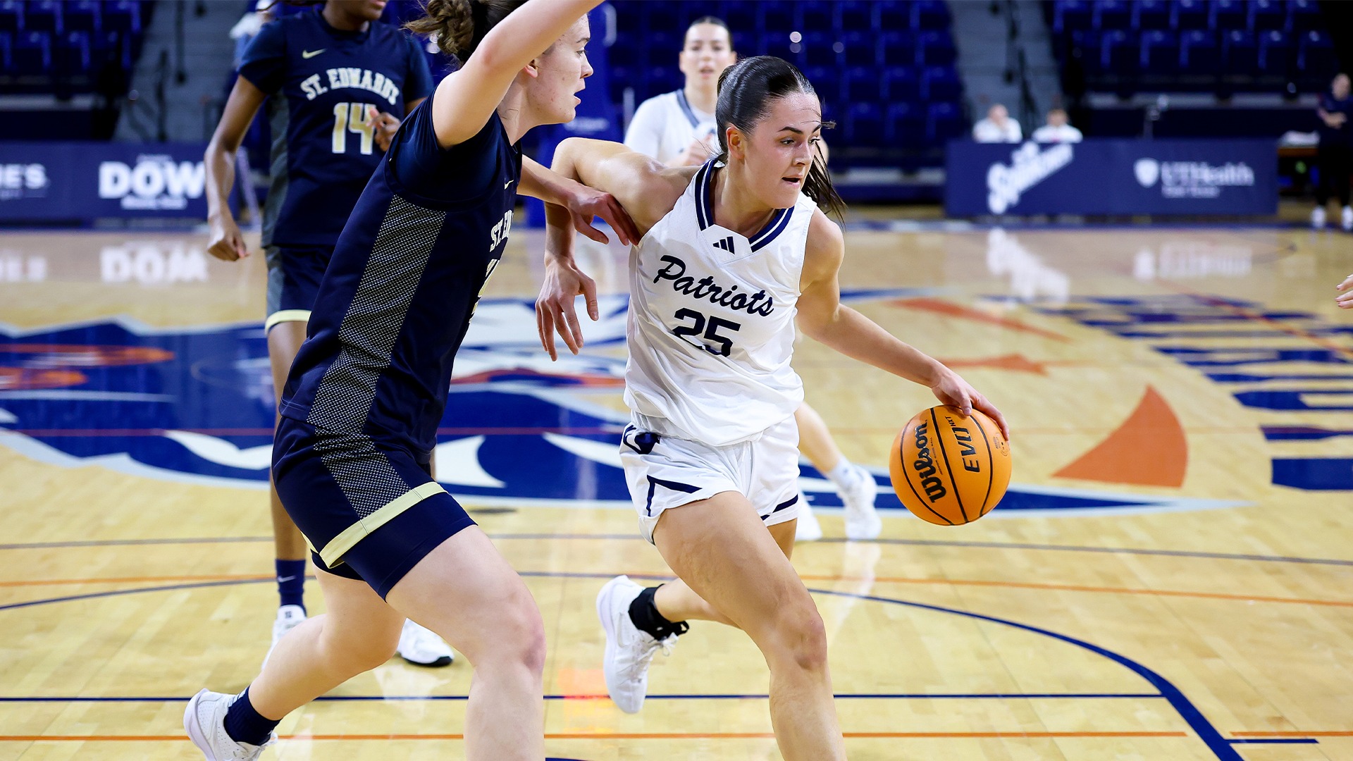 Leila Davis dribbles into the paint against St. Edward's.