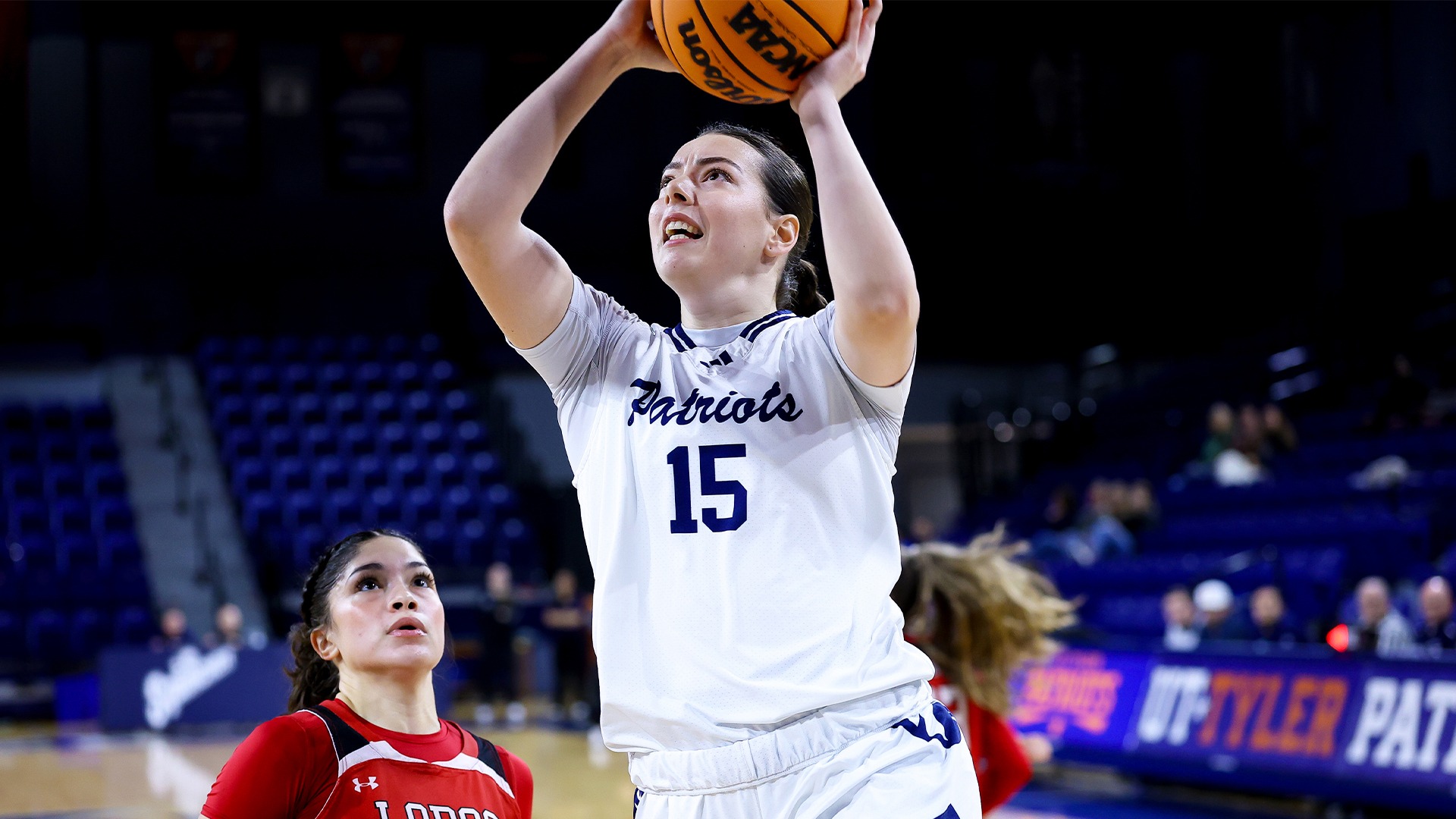Nikolina Vukcevic drives to the basket for a layup against Sul Ross State.