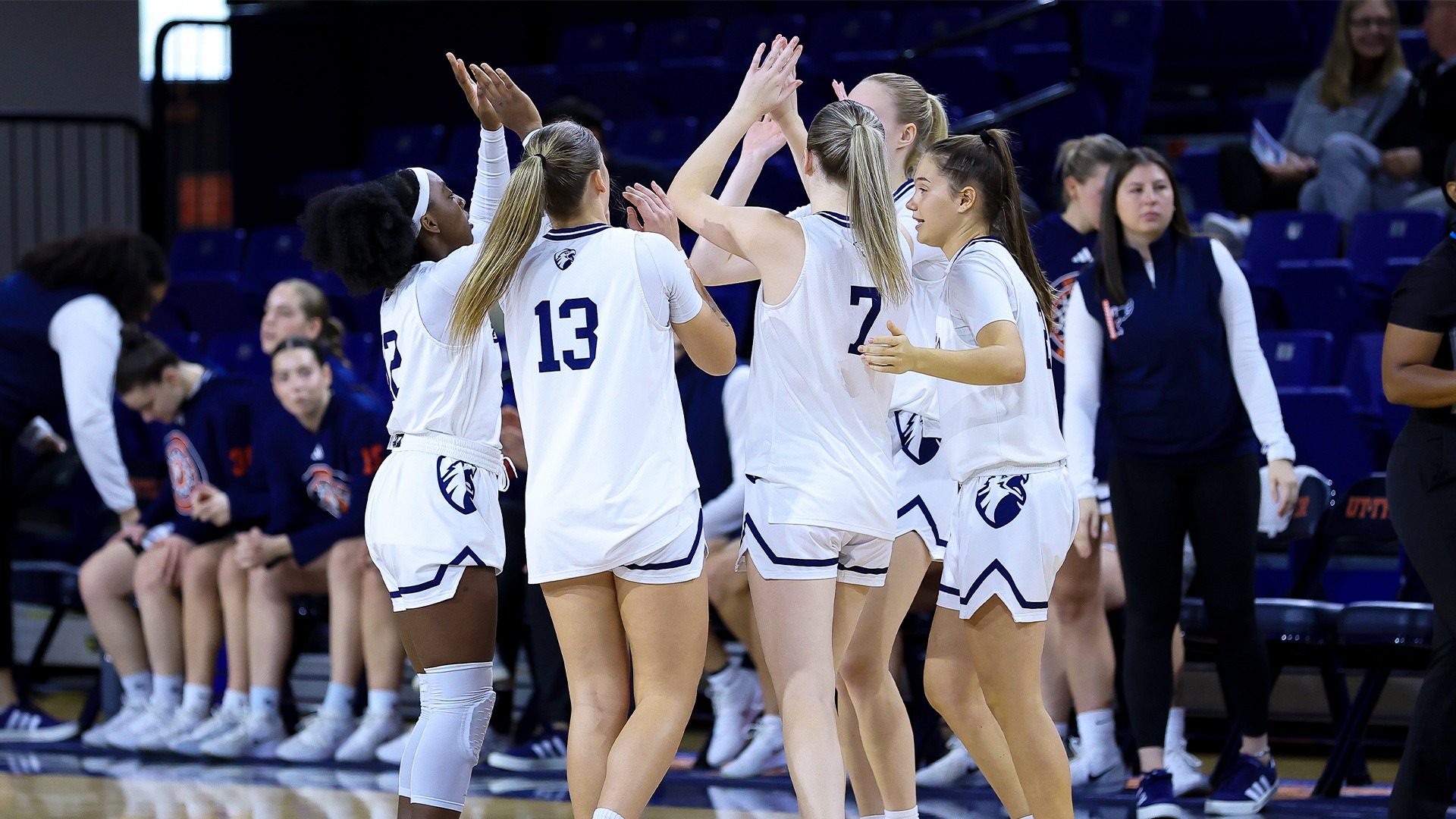UT Tyler Women's Basketball high fives before taking on Dallas Christian.