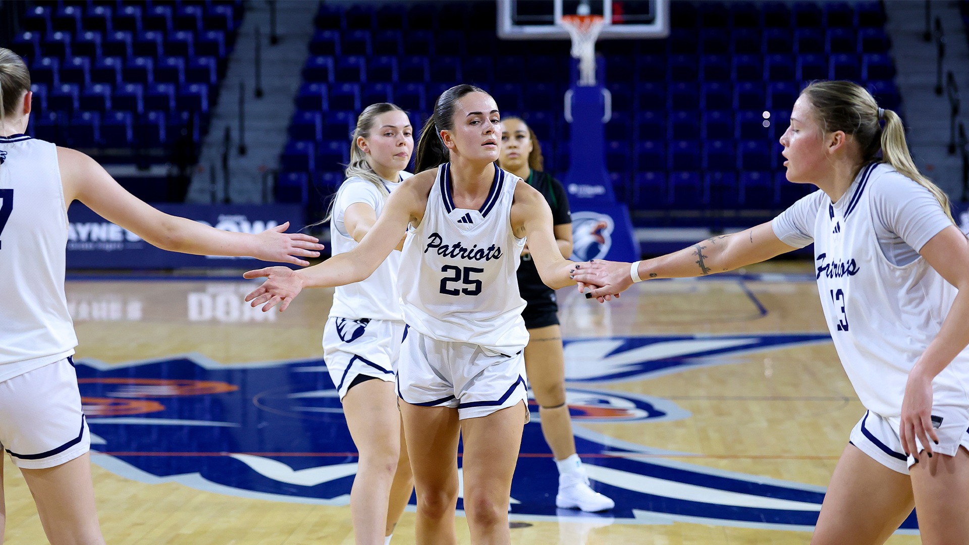 Leila Davis high fives a teammate after a free throw