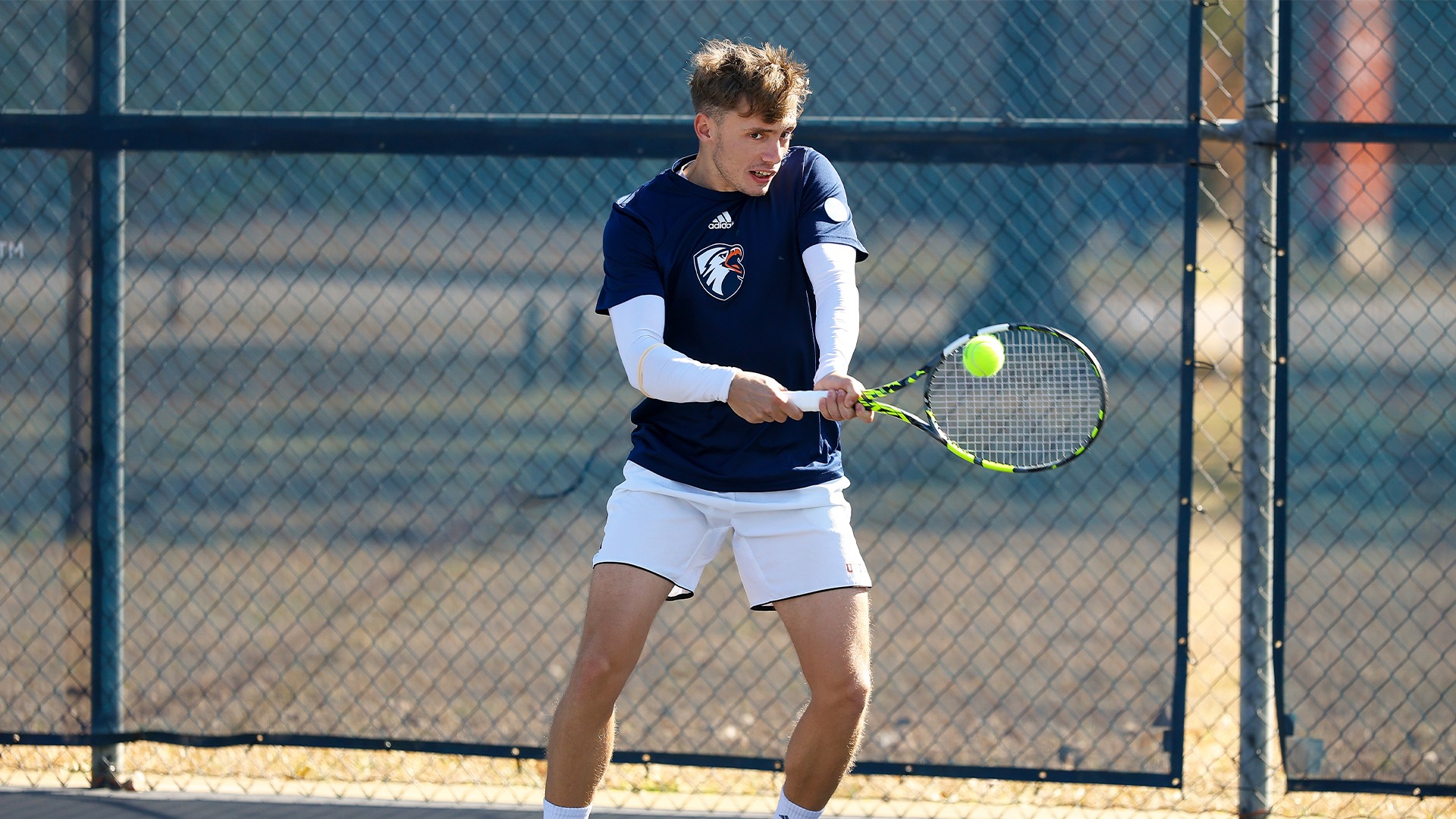 Jordi Garcia Portell plays a backhand against Jacksonville College