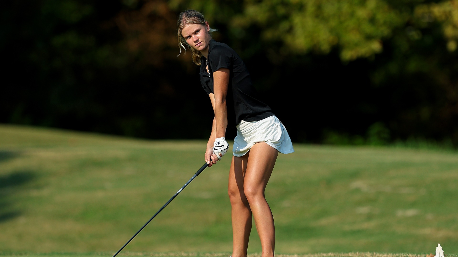 Martha Laremark prepares for a drive at Hollytree Country Club
