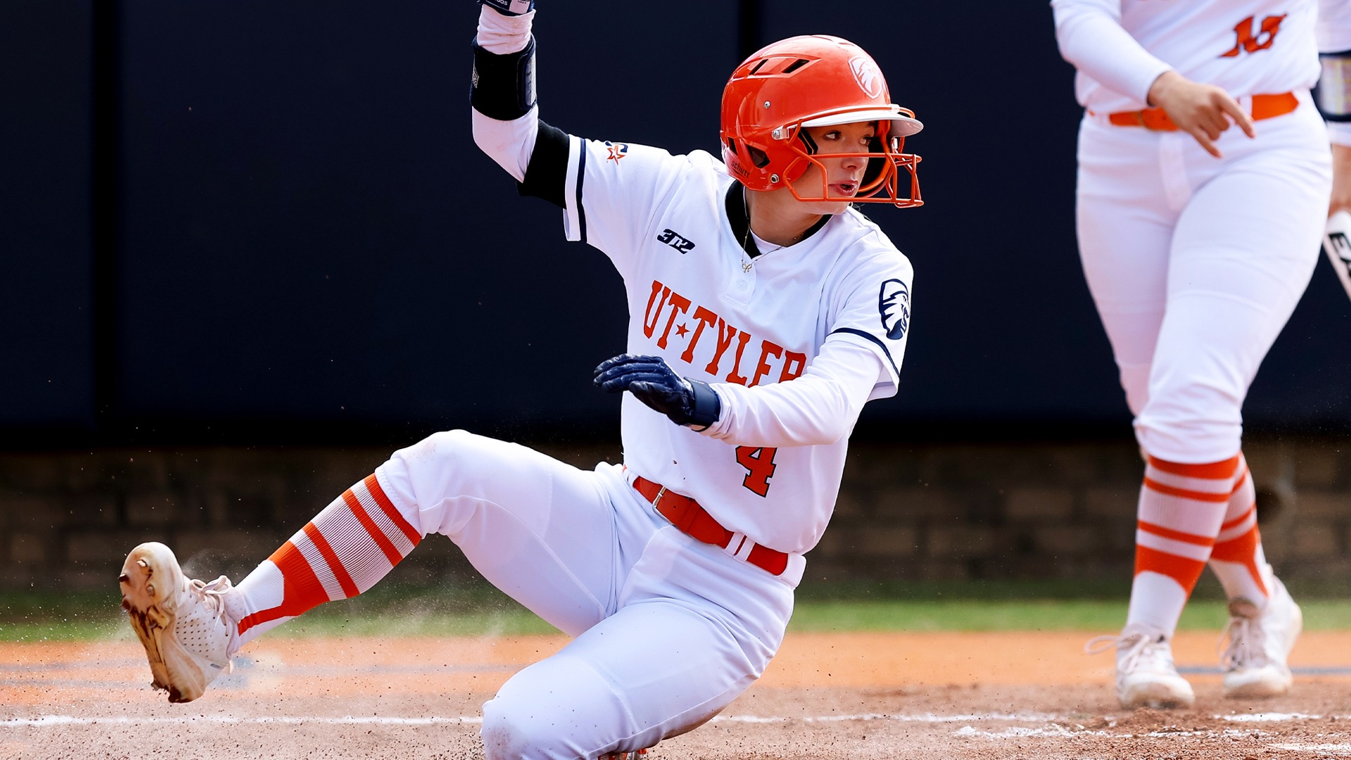 Berlyn Grossman slides into home against Lubbock Christian