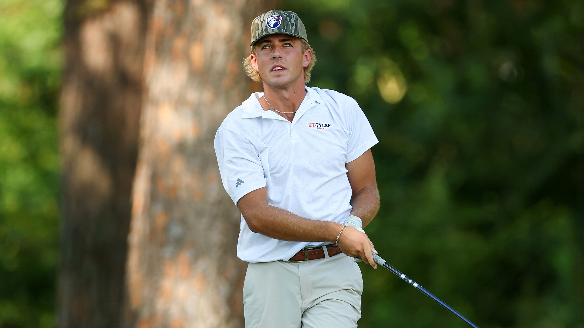 Corbin Murray watches a tee shot at Hollytree Country Club.