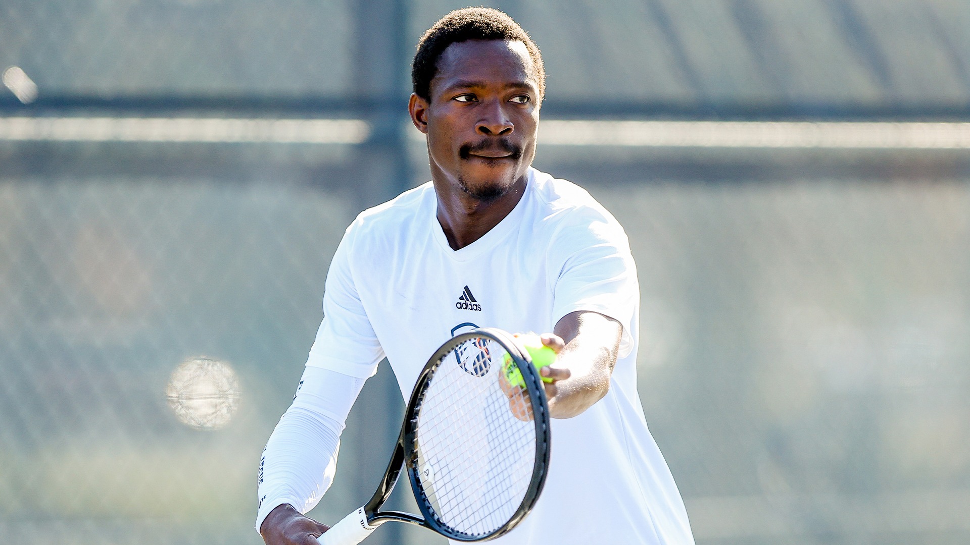 Samuel Antwi prepares for a serve against West Florida.