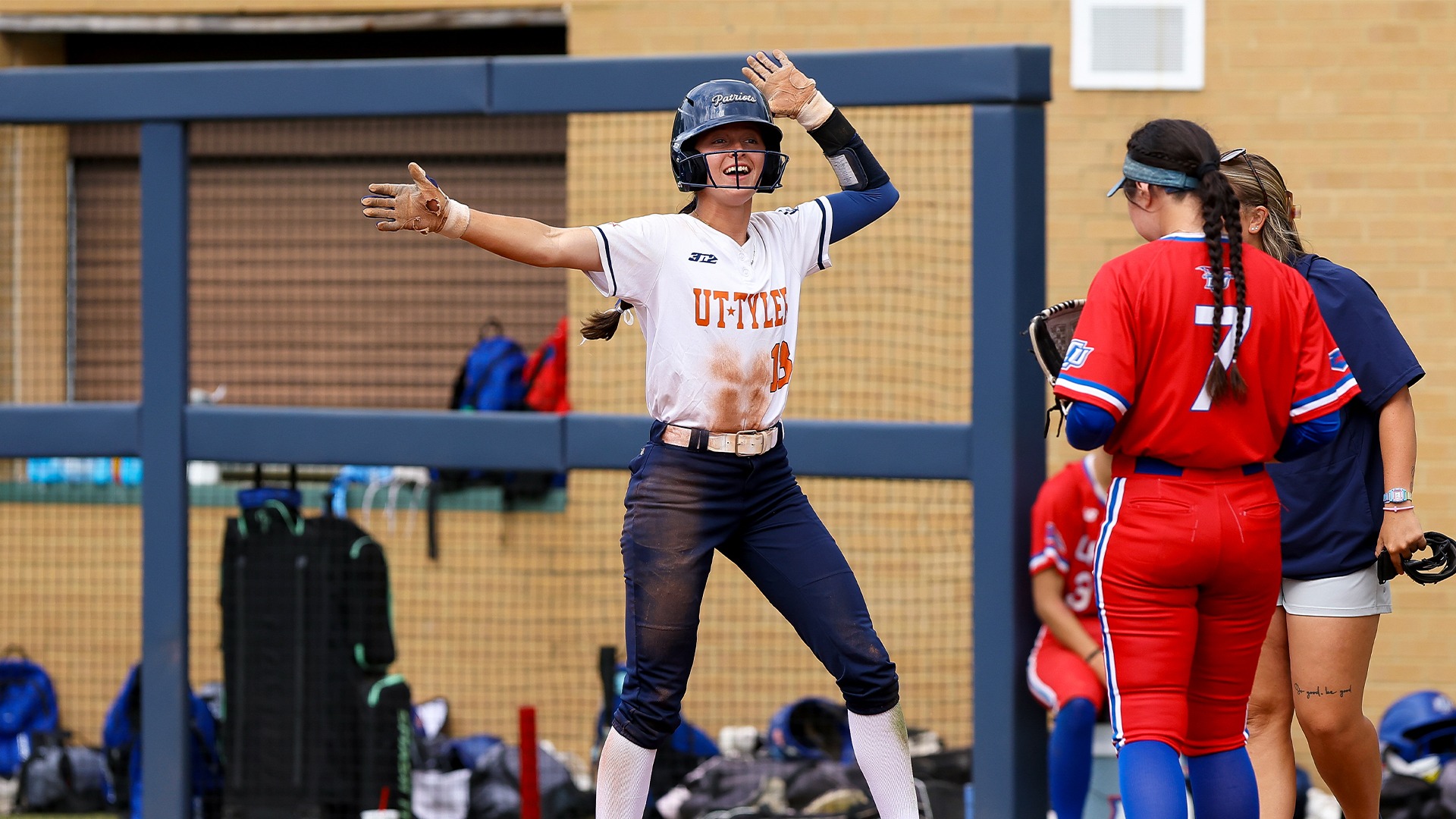 Layne Reh celebrates at first base after a base hit against Lubbock Christian