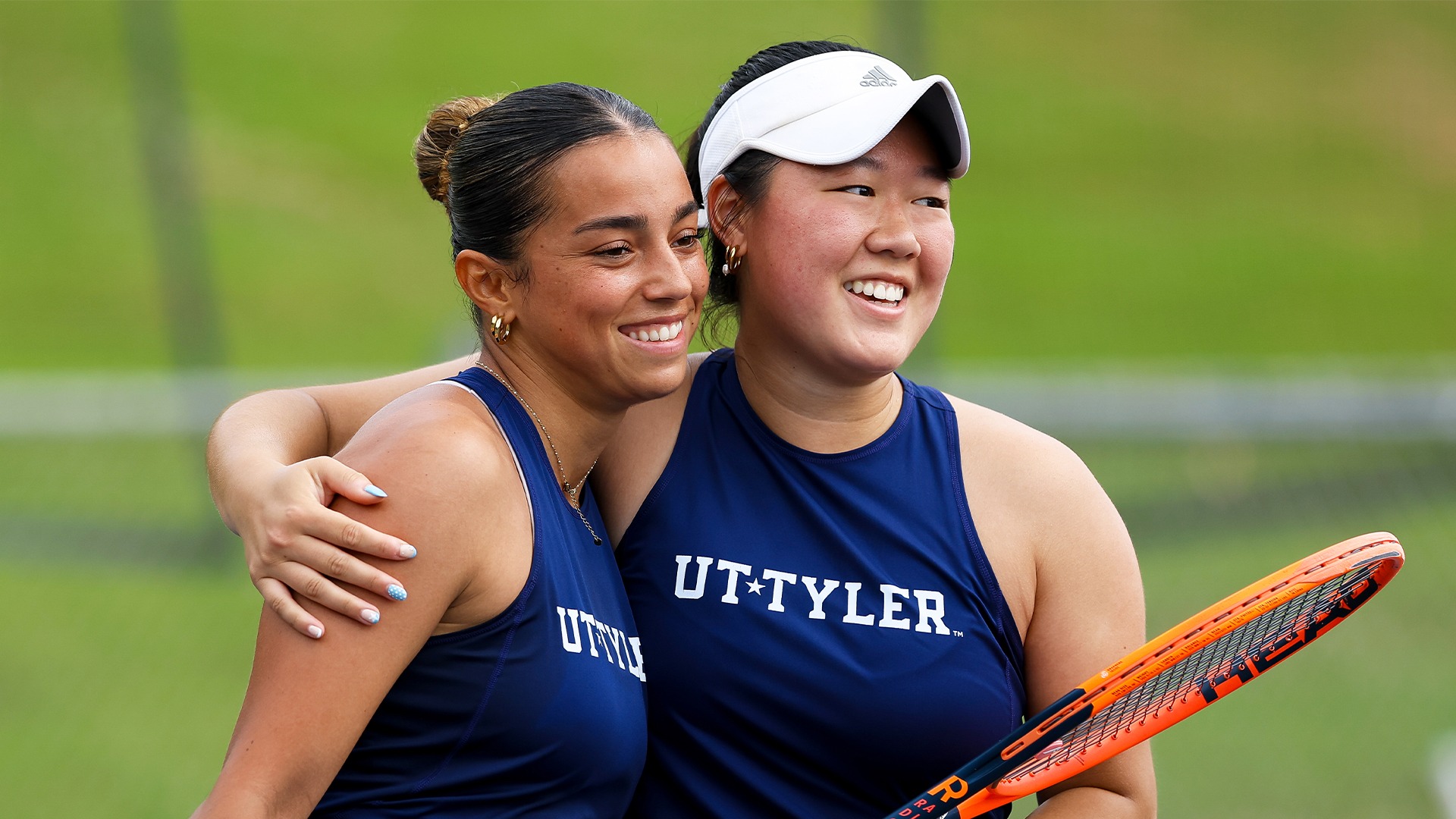 Carla Rodier and Hailey Zhang hug after a point against Midwestern State.