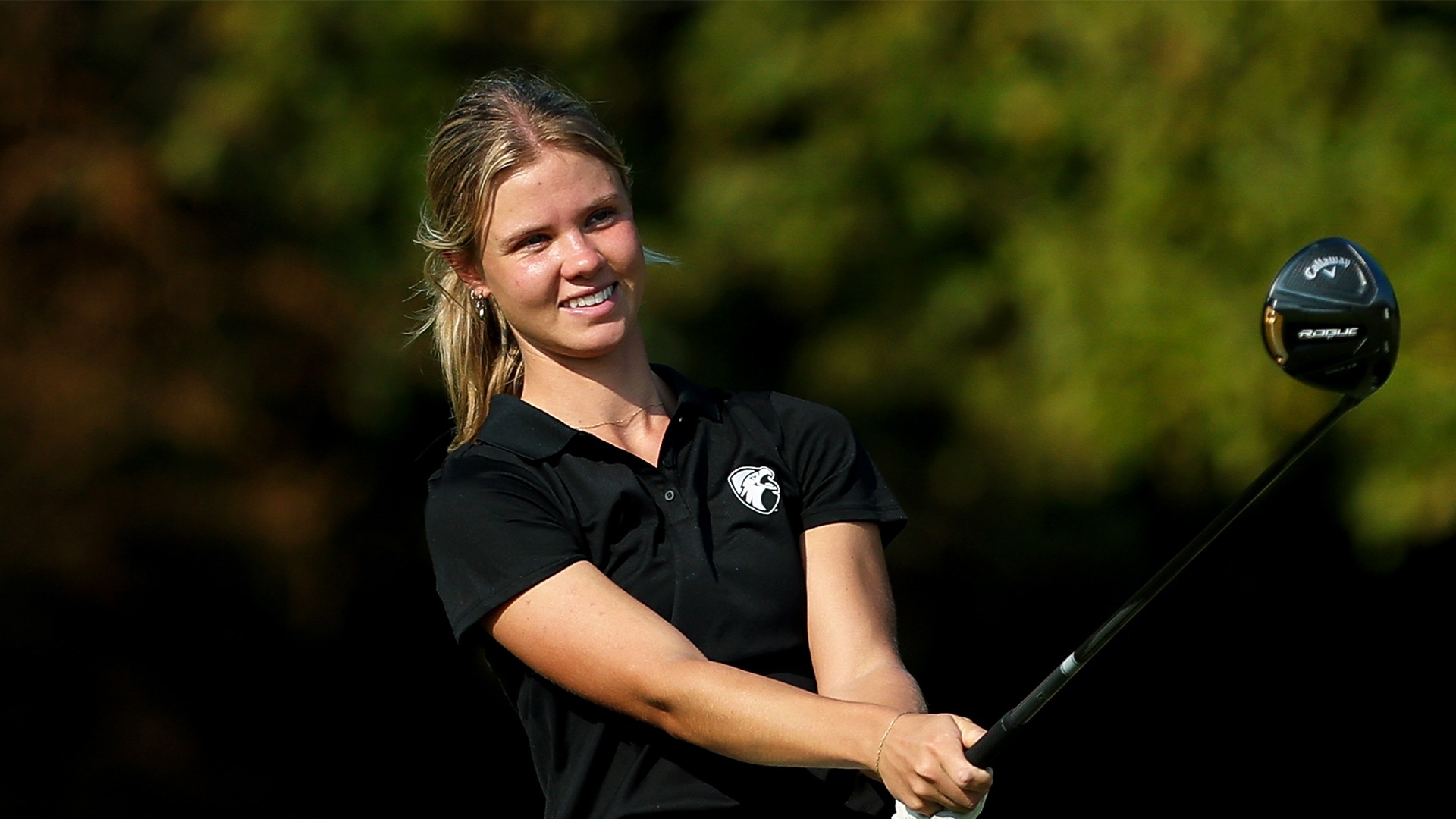 Martha Laremark smiles after a tee shot at Hollytree Country Club.