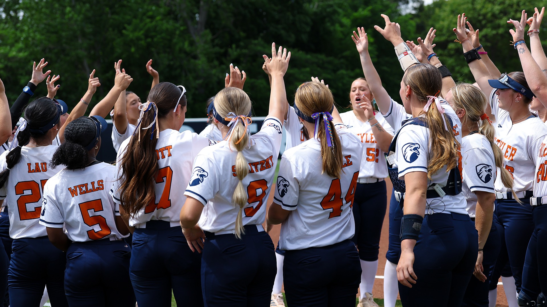 UT Tyler softball breaks down a huddle before taking on Cameron.