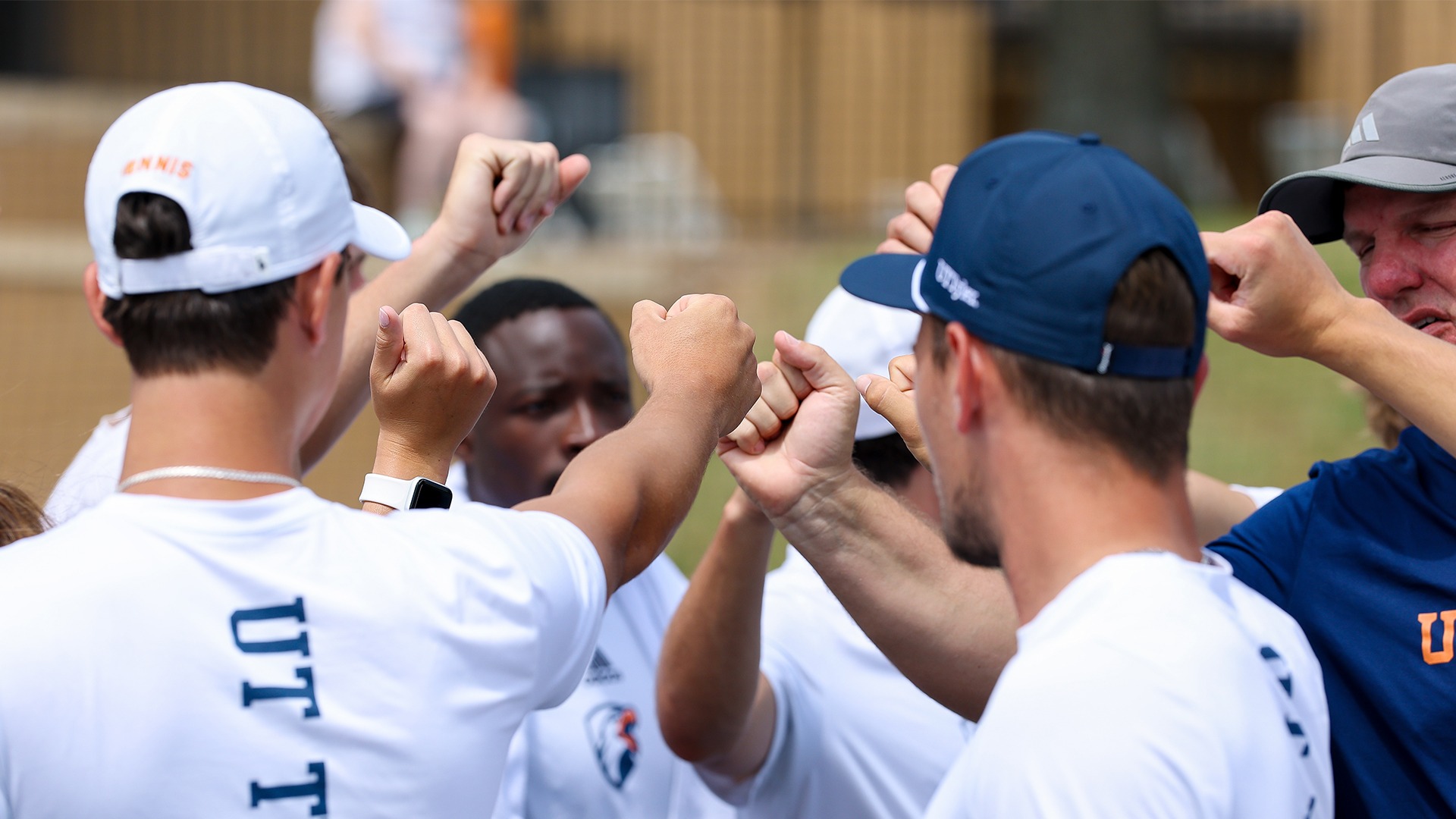 UT Tyler Men's Tennis huddles up in a match against Ouachita Baptist