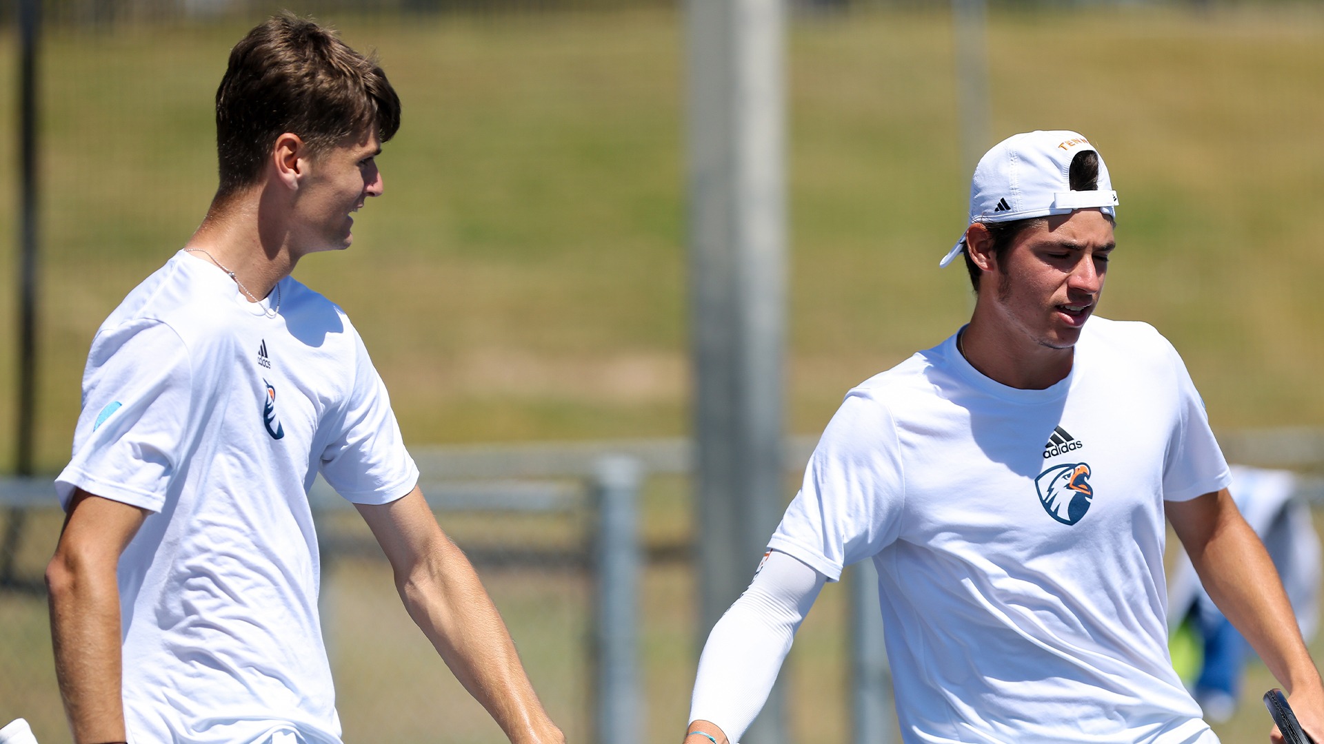 Artiom Dorofeev and Malo Poulesquen high five after a point against Hawai'i Hilo