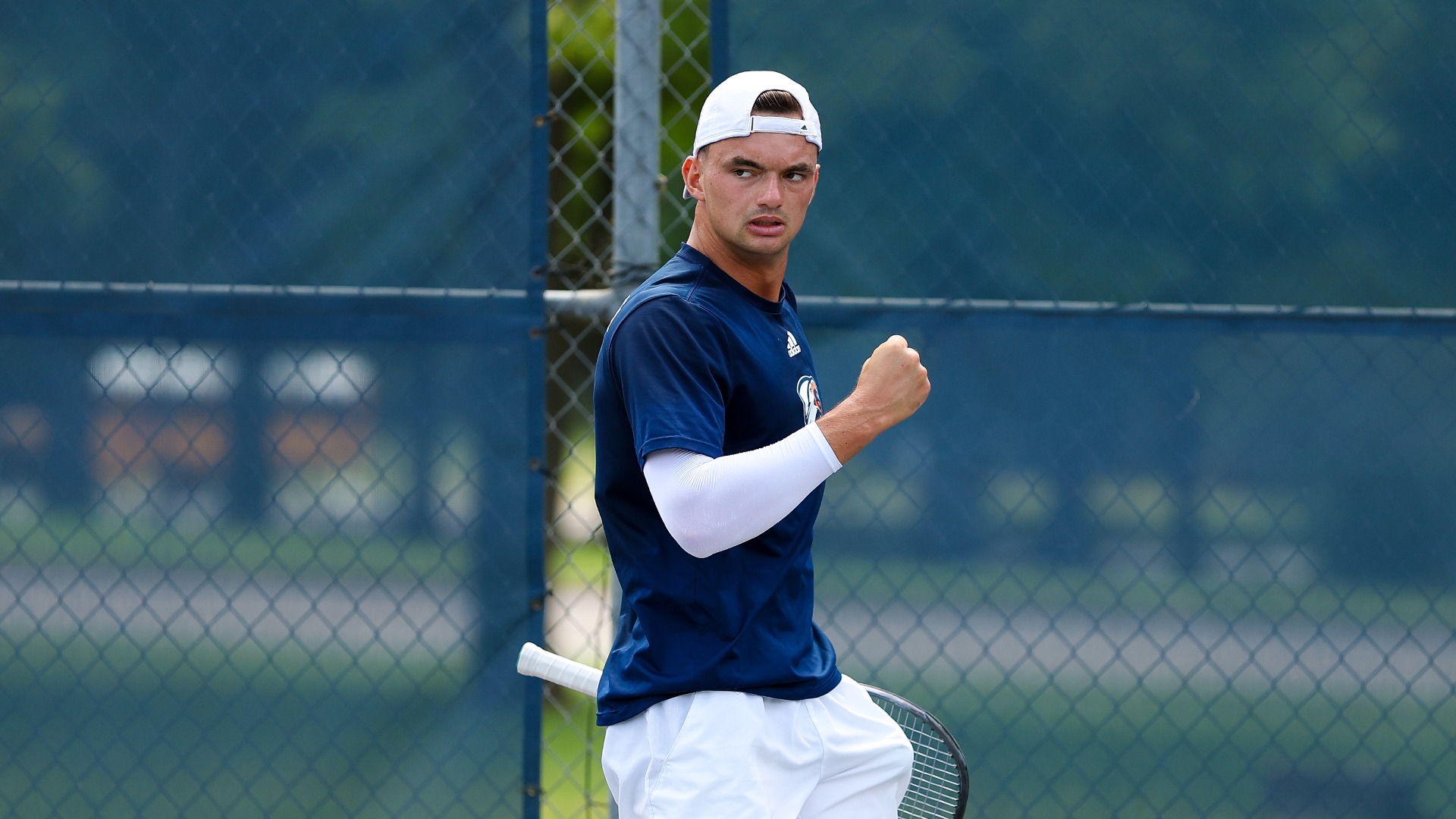 Carel Wessel fist pumps after a big point in singles.