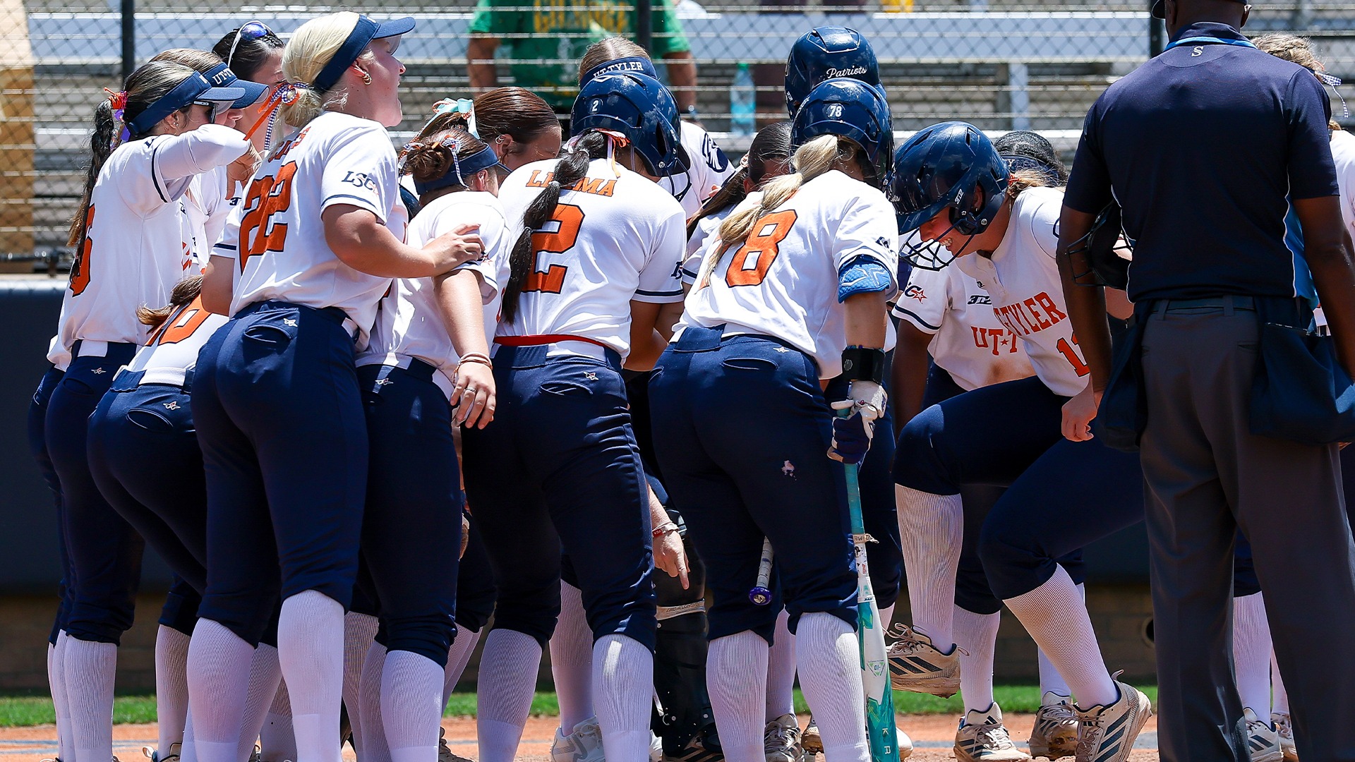 UT Tyler crowds around the plate as Taryn Barney celebrates a homer against Texas A&M-Kingsville.