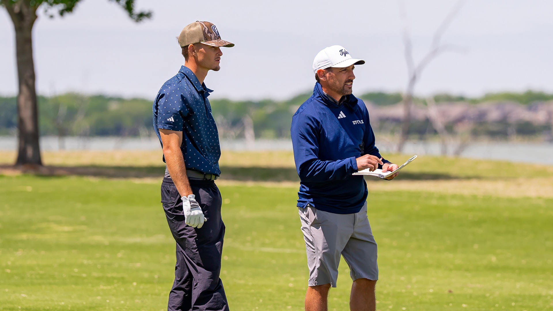 Preston DeSerrano and Coach Mike McMunn prepare for a shot at the LSC Championships.