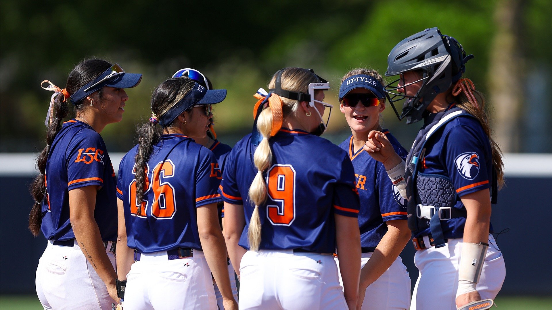 UT Tyler's infield crowds around the circle during a visit.