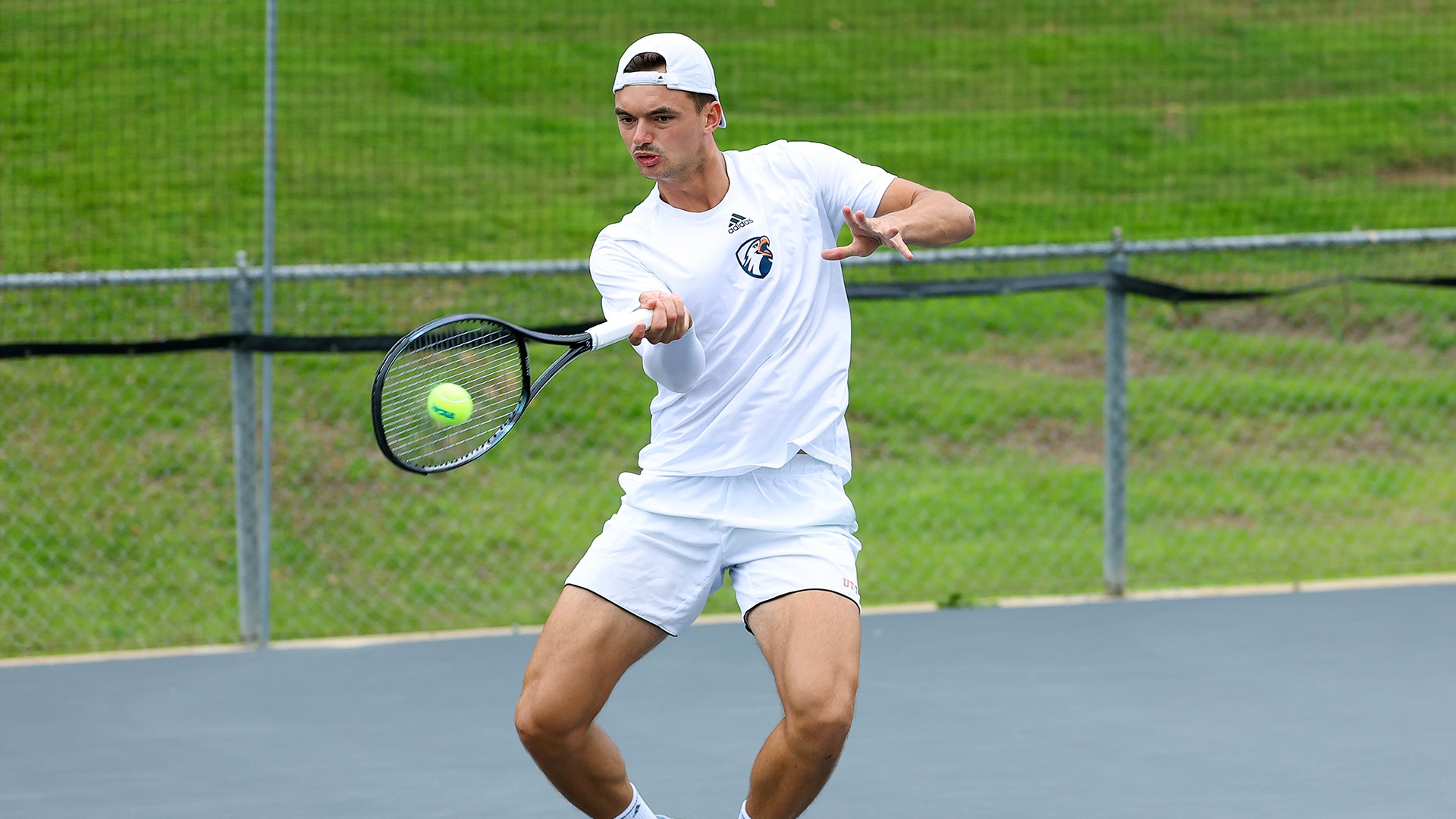 Carel Wessel hits a forehand against Cameron in the NCAA South Central Region Tournament.