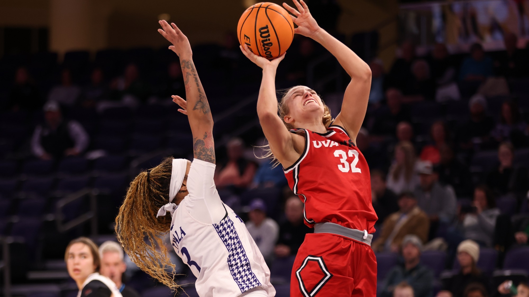 Caroline Mullins shoots the ball over HPU's Nevaeh Zavala -- 2025-26